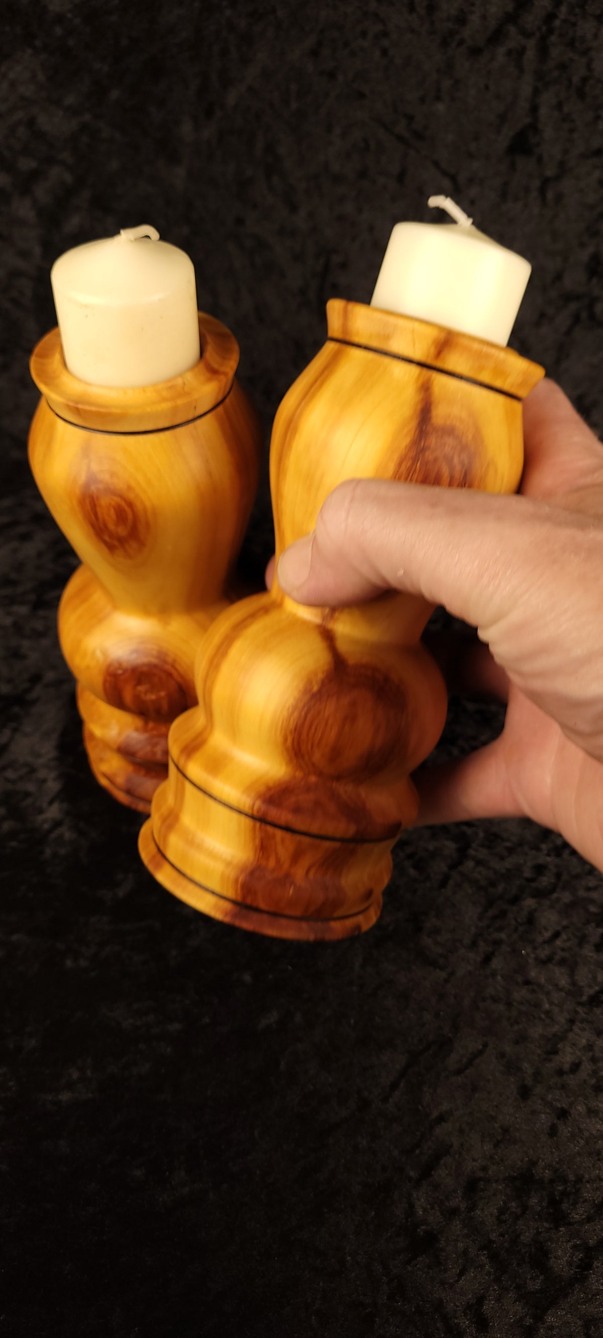 Three aspen candle holders grouped together showing varied knot patterns