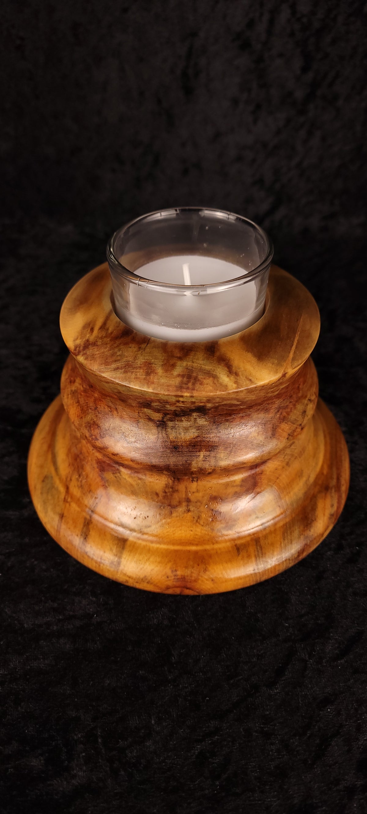 Handcrafted Aspen Candle Holder No. 5 with lit candle, overhead angled view