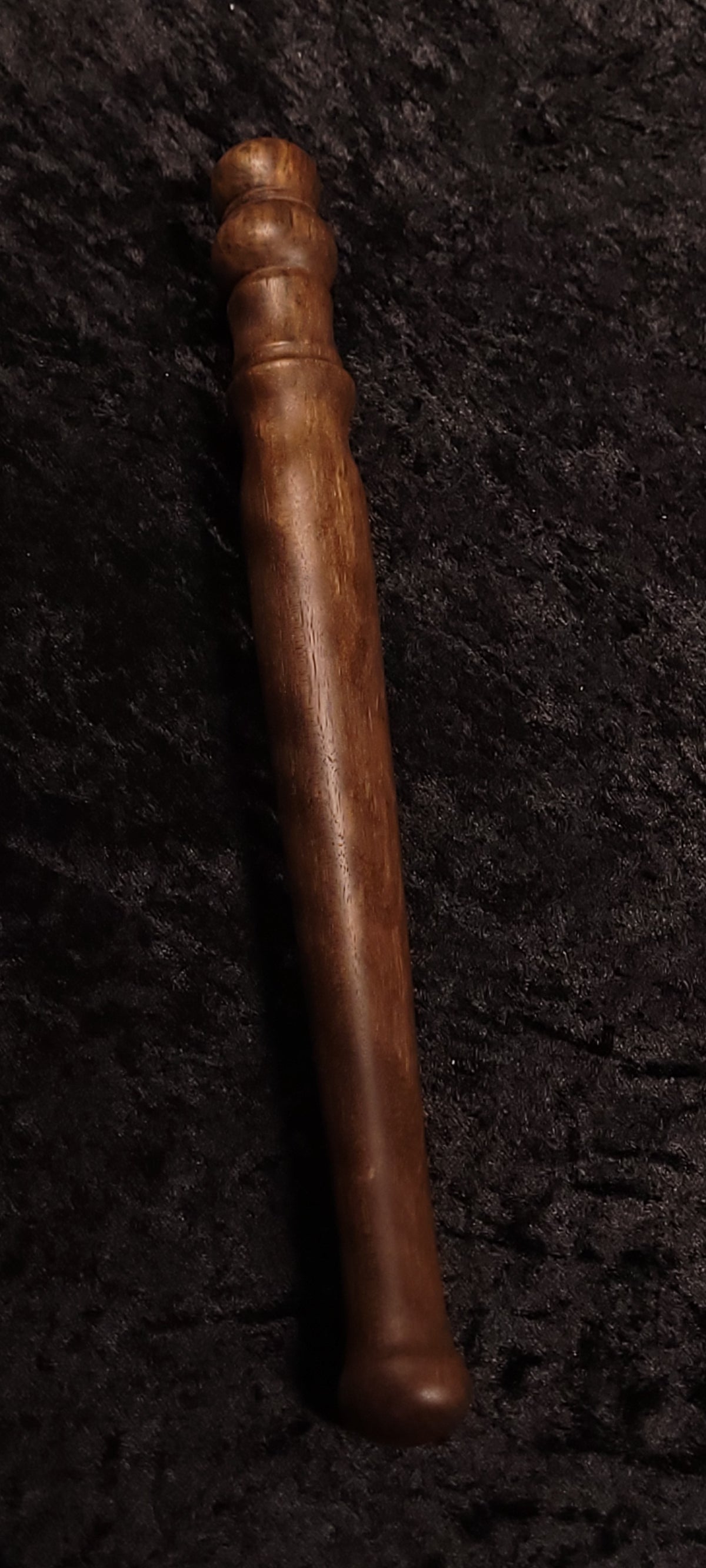 Walnut spurtle handle close-up showing turned detail