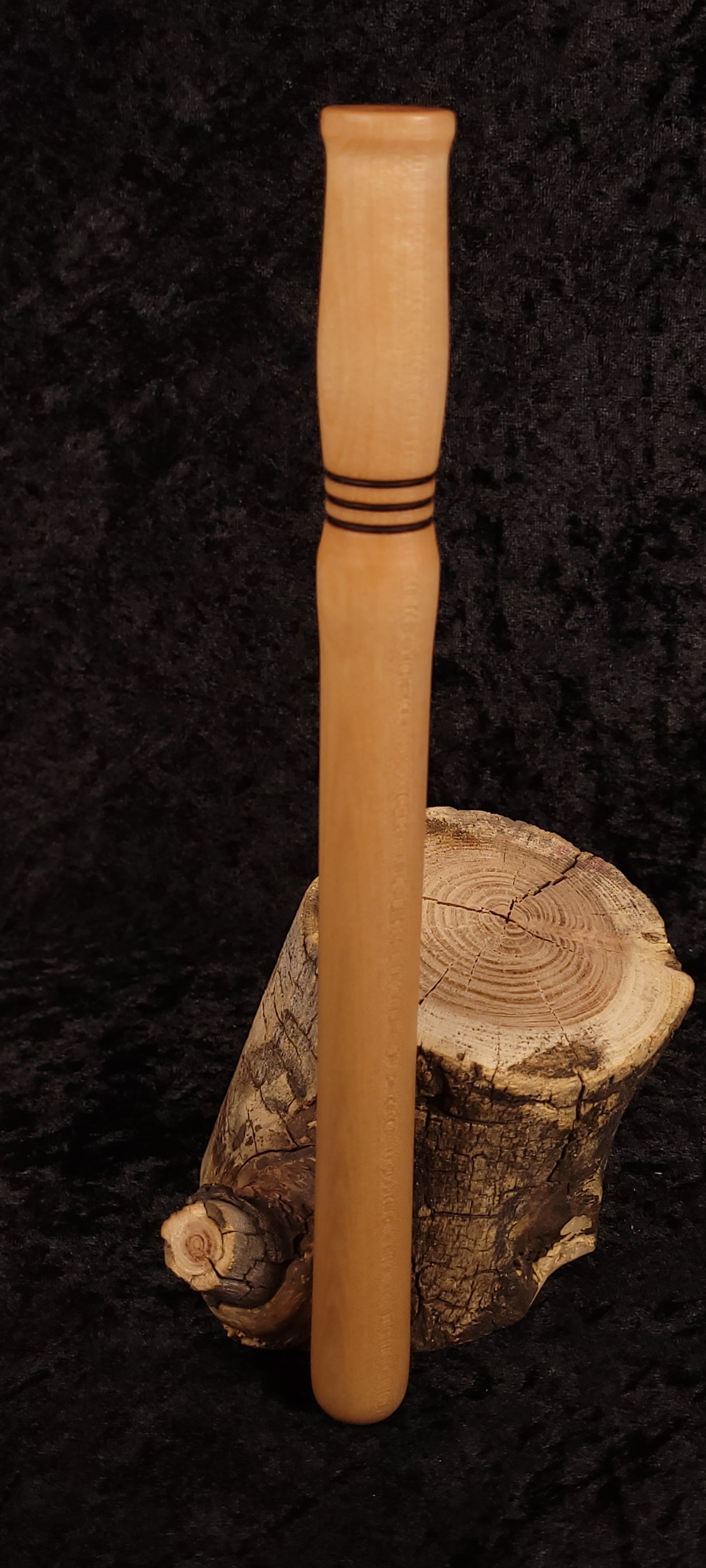 Curly maple spurtle side view showing turned rings