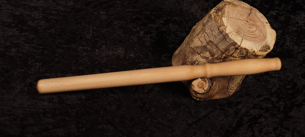 Handcrafted curly maple spurtle - front view