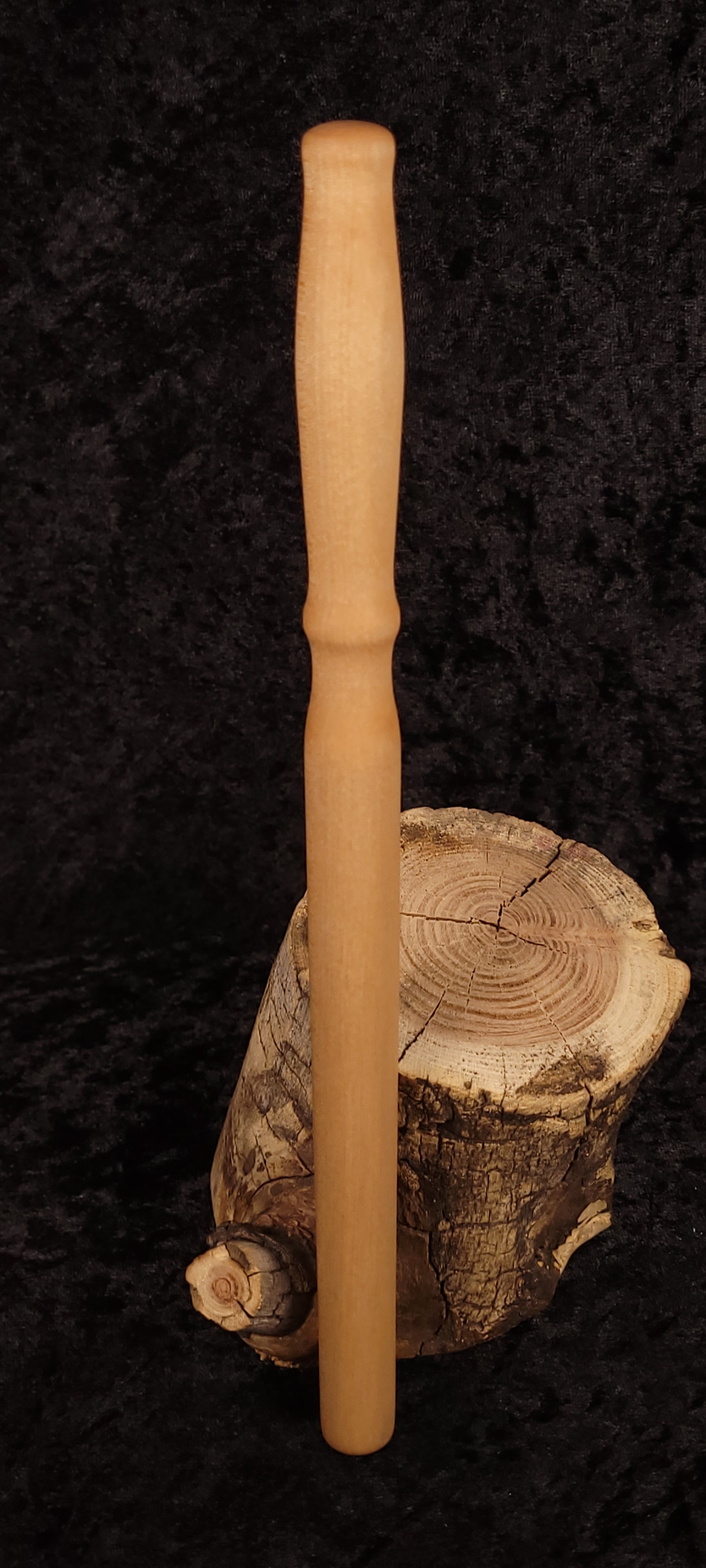 Handcrafted curly maple spurtle - angled view