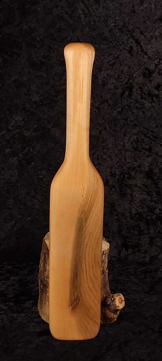Curly maple spatula front view standing upright