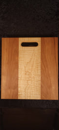 Cherry and curly maple cutting board front face, wide curly maple center stripe