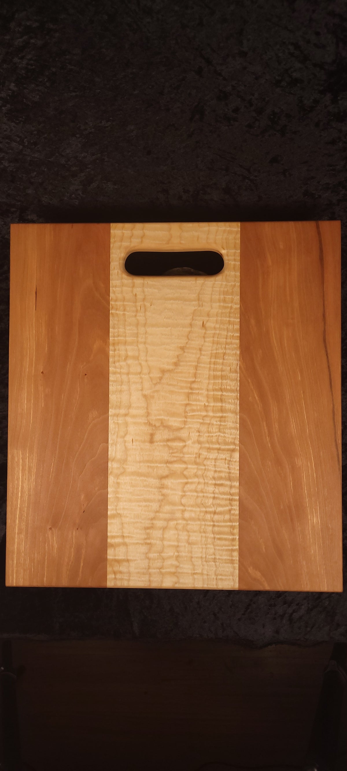 Cherry and curly maple cutting board front face, wide curly maple center stripe