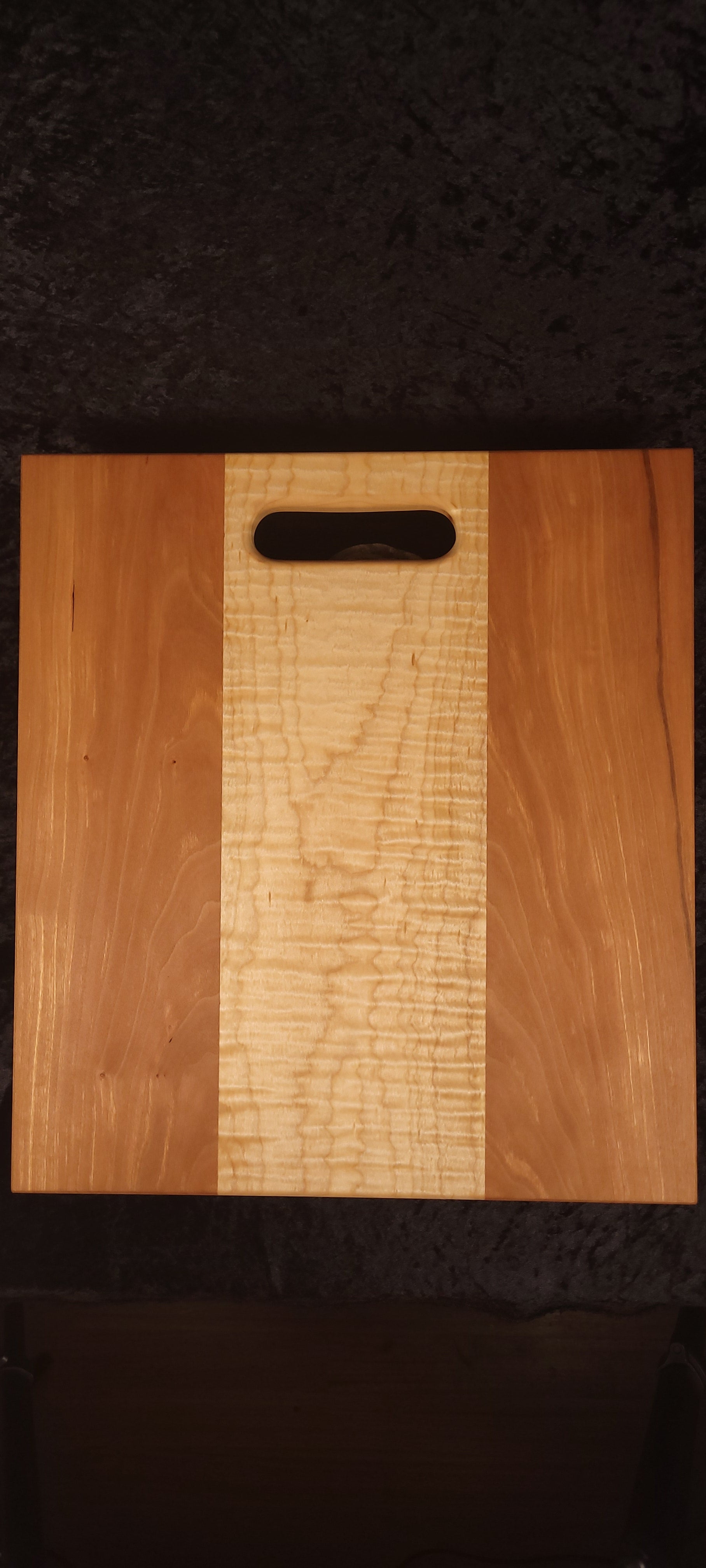 Cherry and curly maple cutting board front face, wide curly maple center stripe
