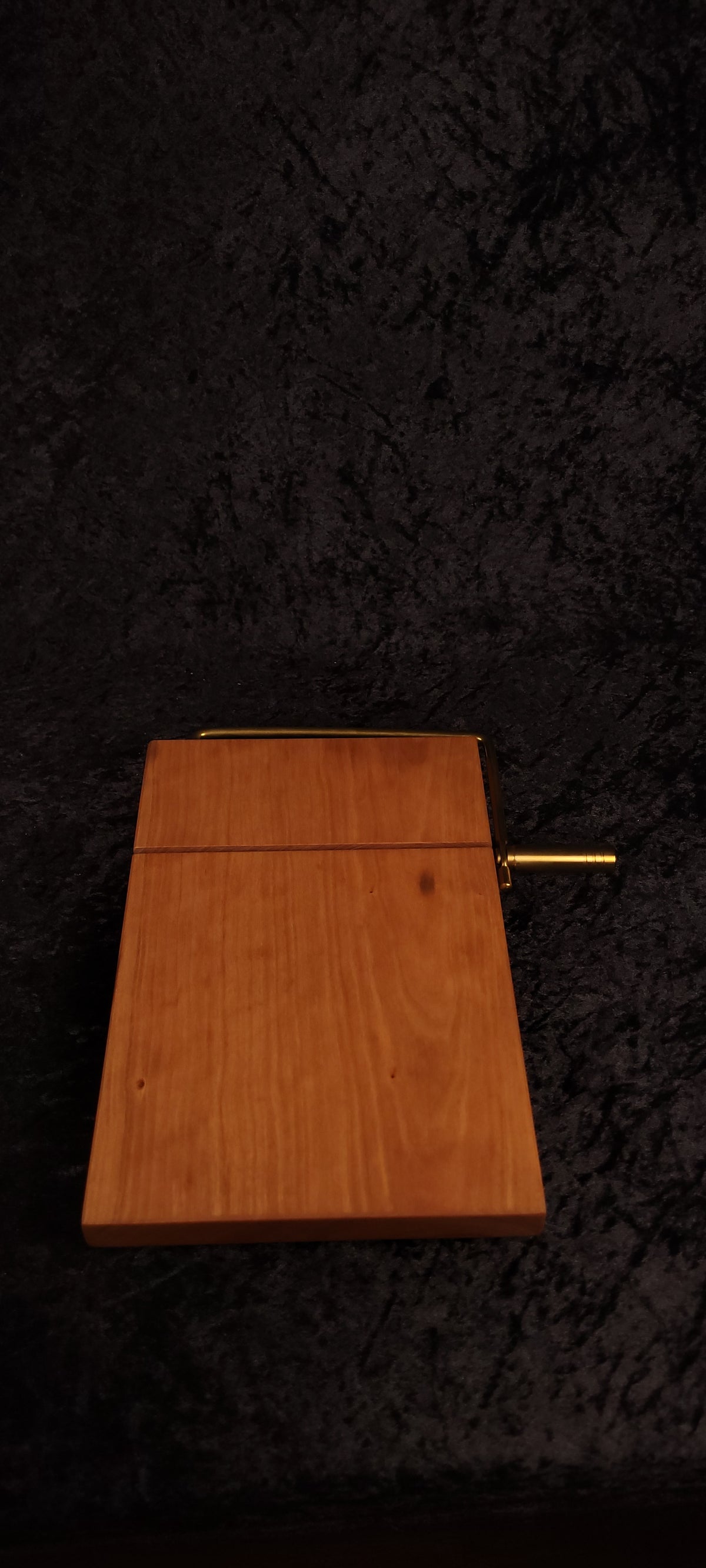 Cherry cheese board angled view showing gold hardware