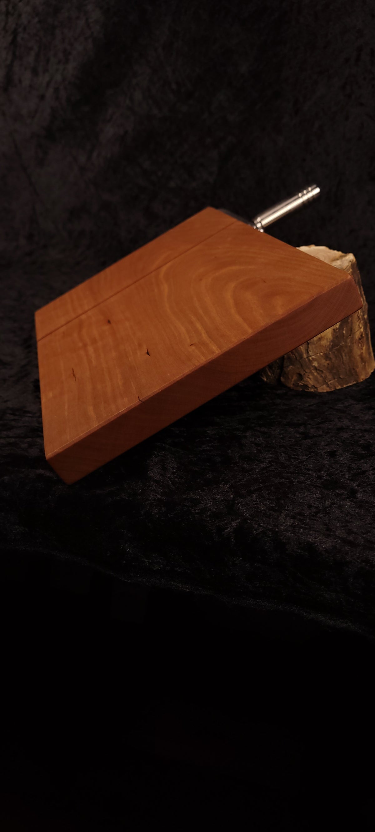 Cherry cheese board bottom view with stainless hardware and rubber feet