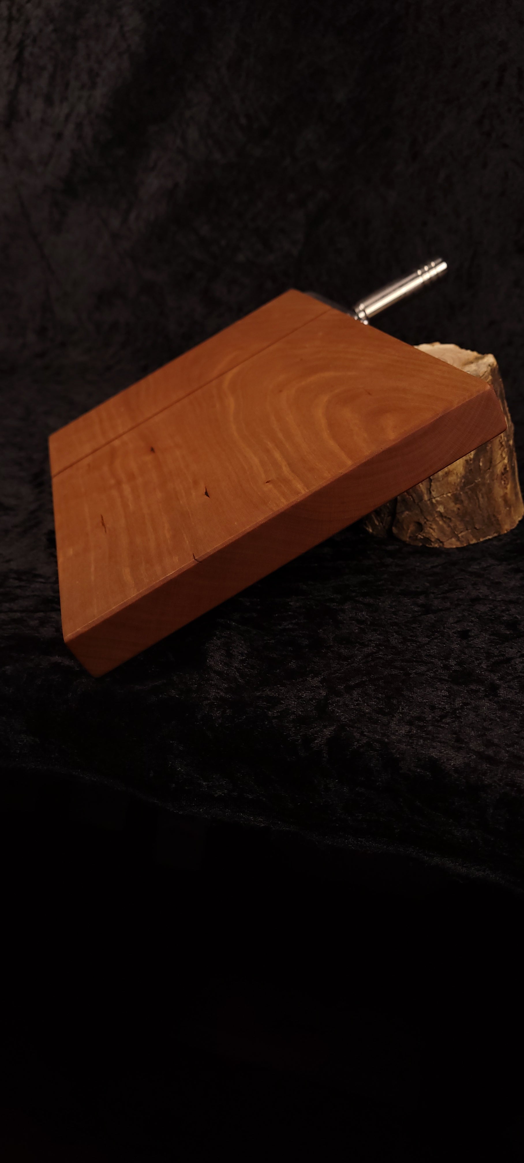 Cherry cheese board bottom view with stainless hardware and rubber feet