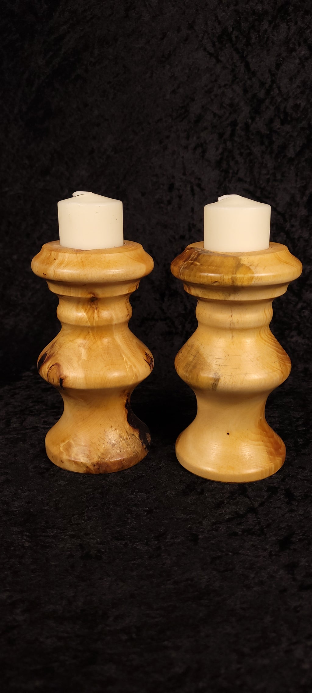 Hand-turned piñon pine candle holder set of 2 front view with pillar candles