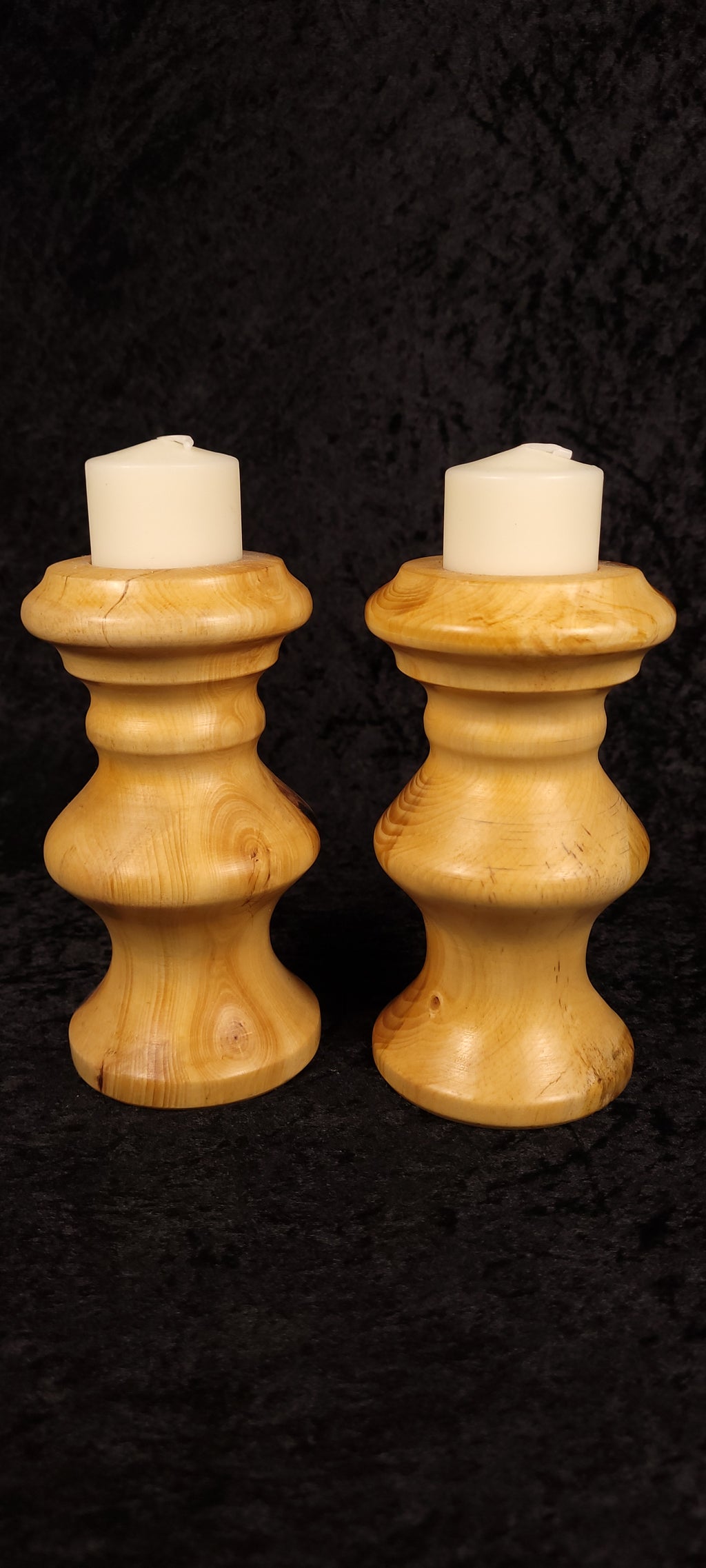 Piñon pine candle holders showing natural grain and knots