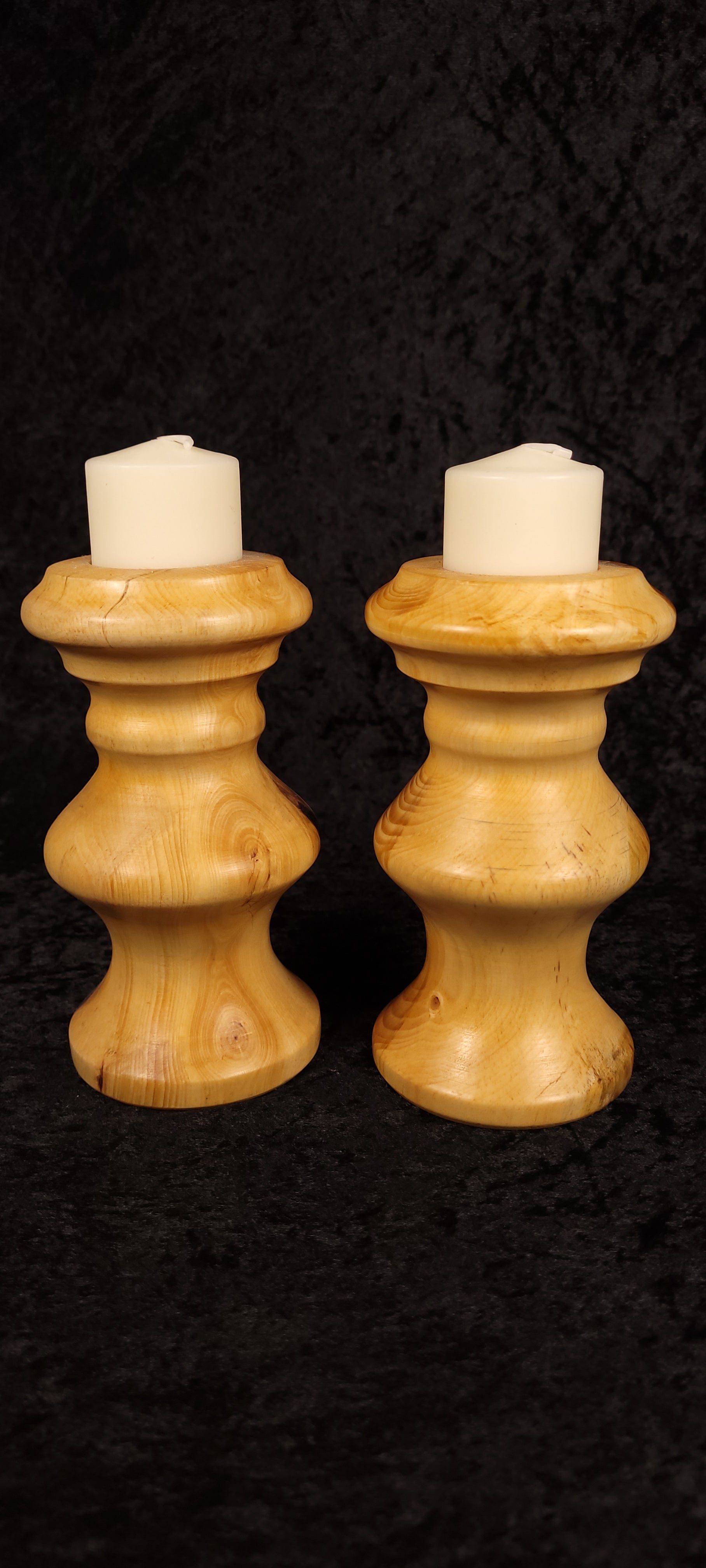Piñon pine candle holders showing natural grain and knots