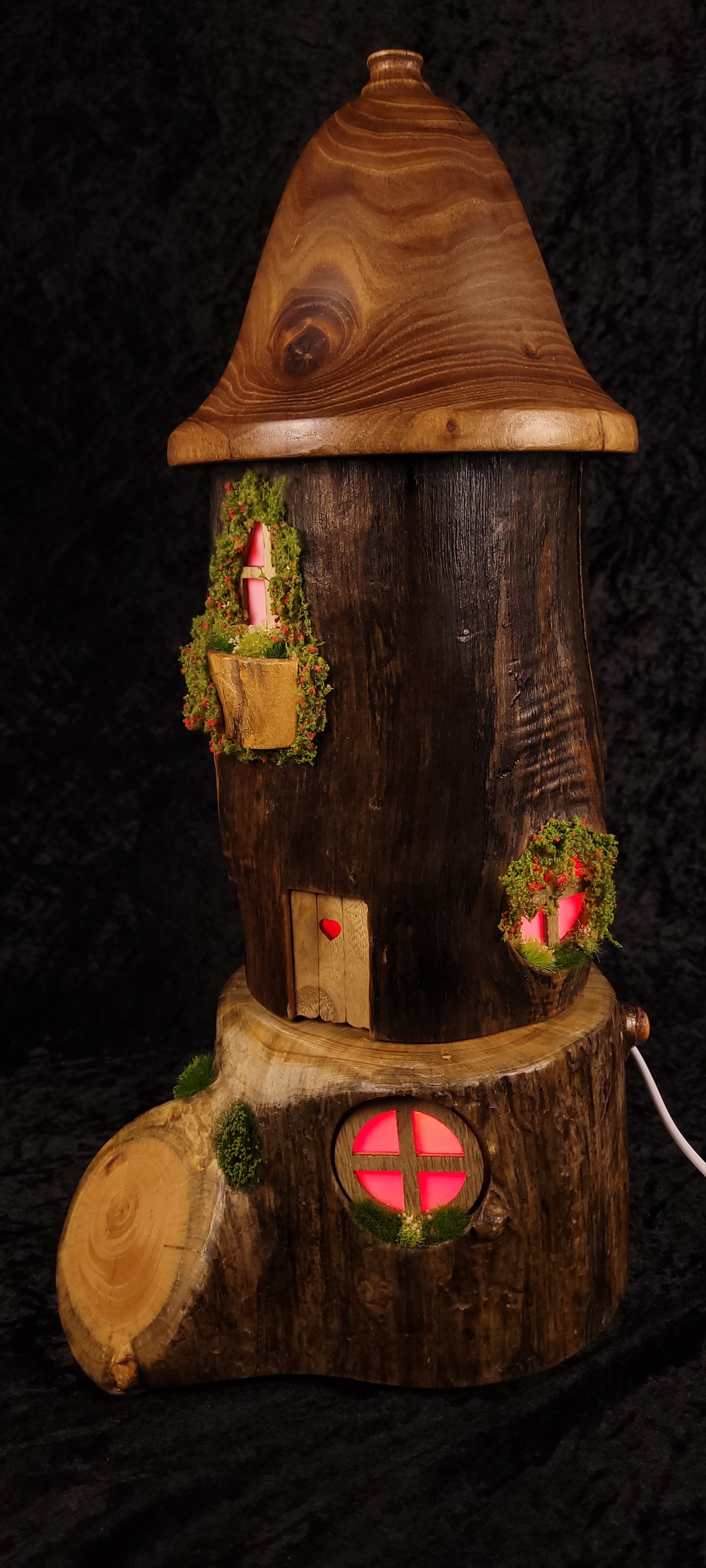 Hand-carved fairy house lamp - green glow side view