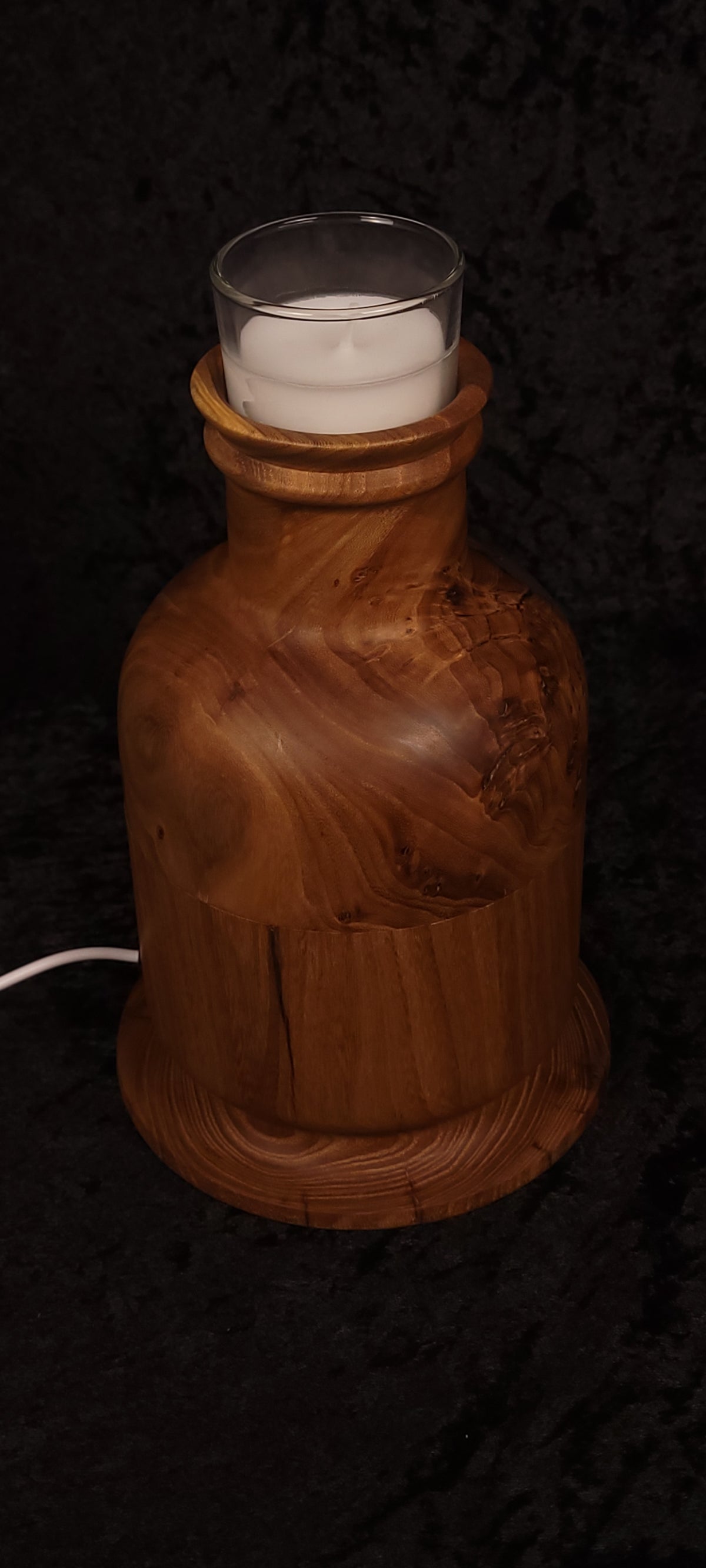 Elm candle lamp lit with purple RGB glow, showing void and turned lid