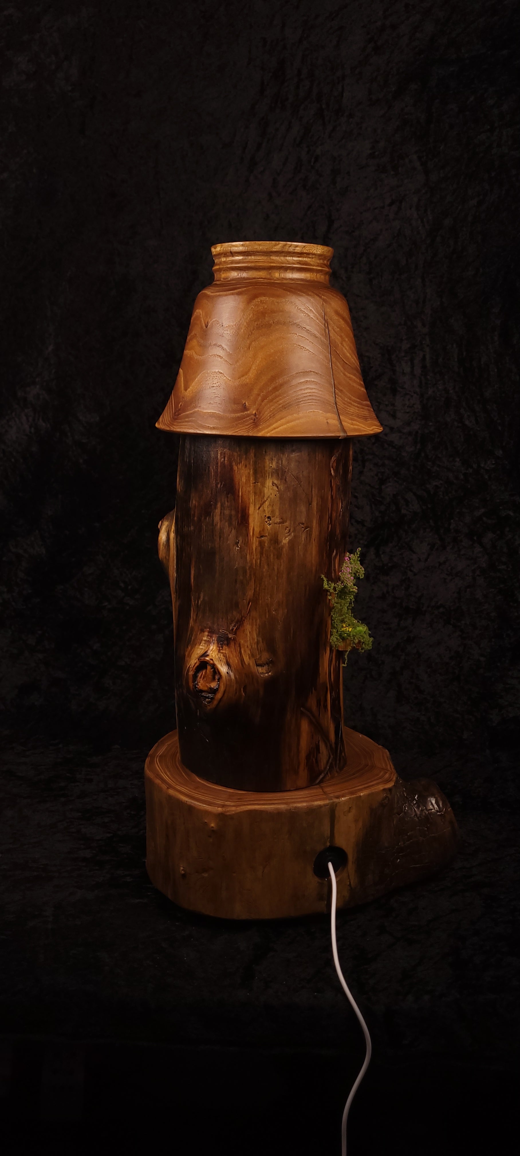 Close-up of hand-turned elm shade showing woodgrain detail