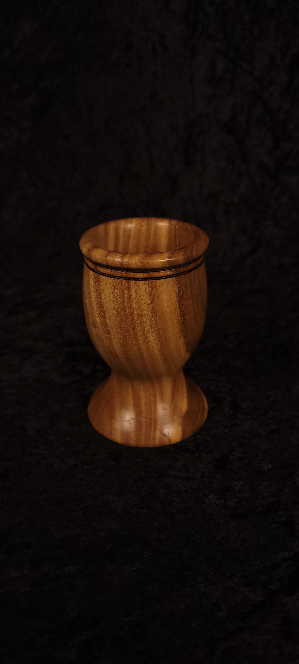 Elm wood toothpick holder empty, showing swirling grain