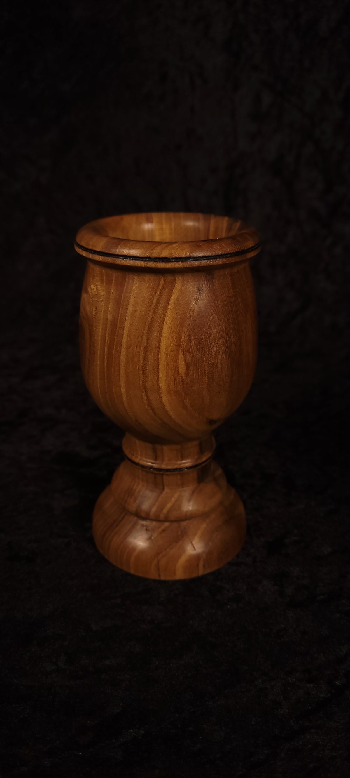 Elm wood toothpick holder showing flowing grain detail