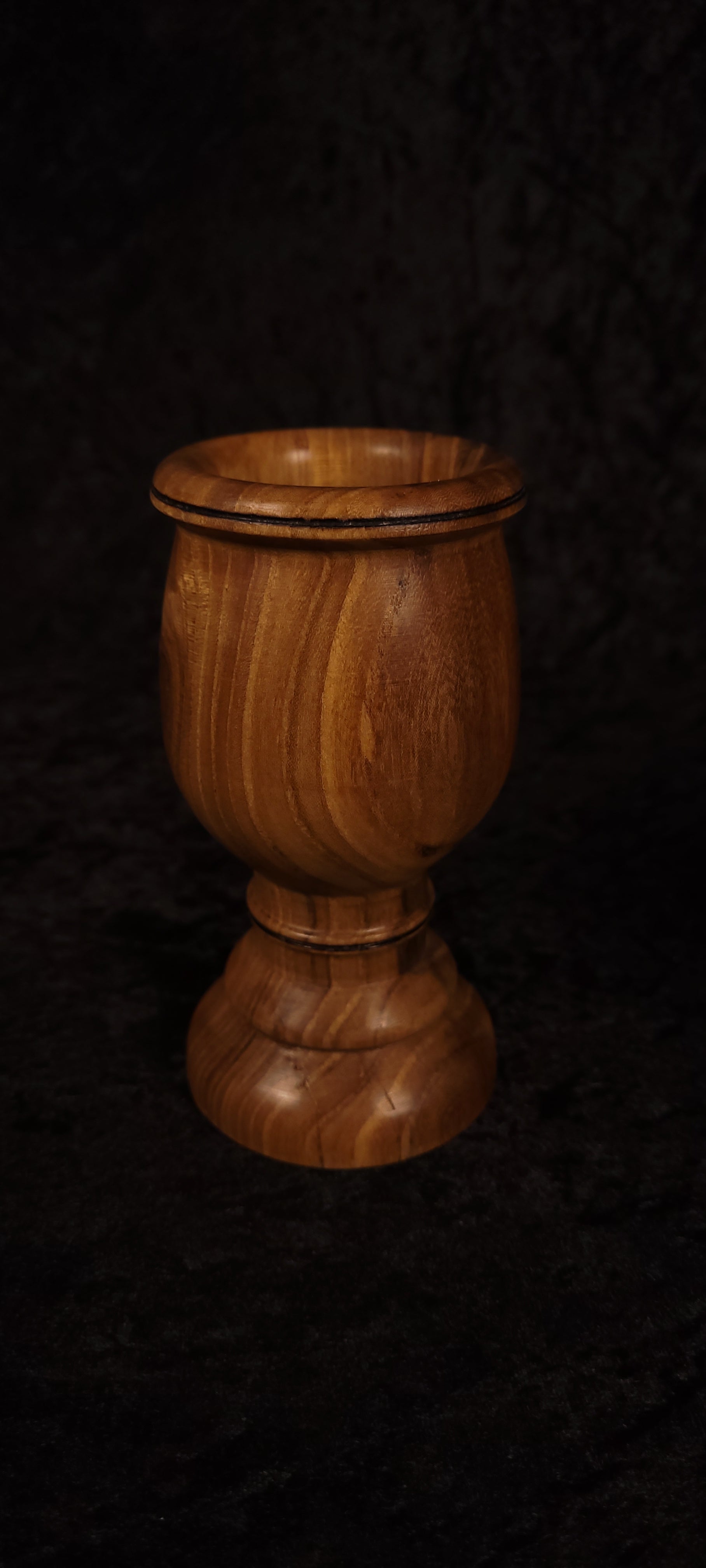 Elm wood toothpick holder showing flowing grain detail