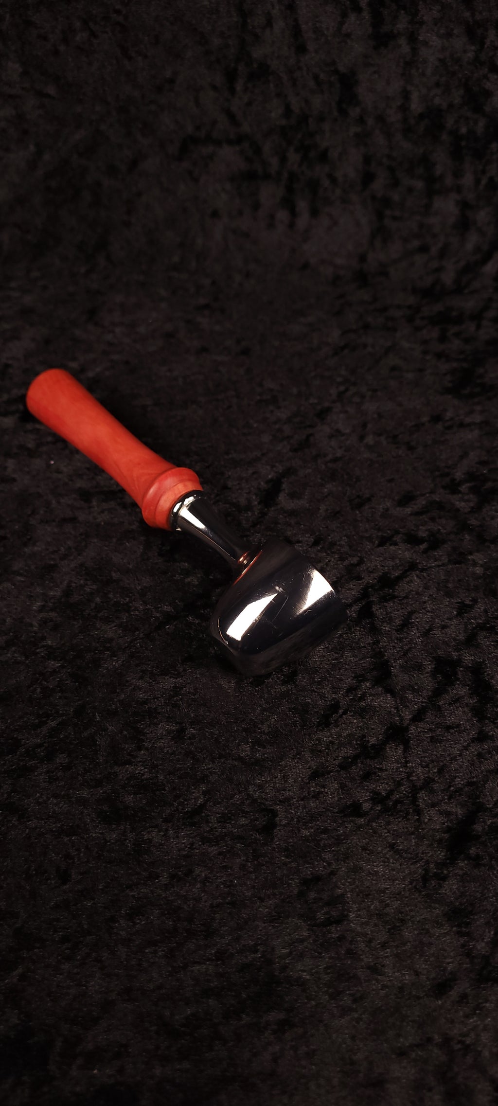 Pink Ivory wood coffee scoop held in hand showing chrome scoop detail
