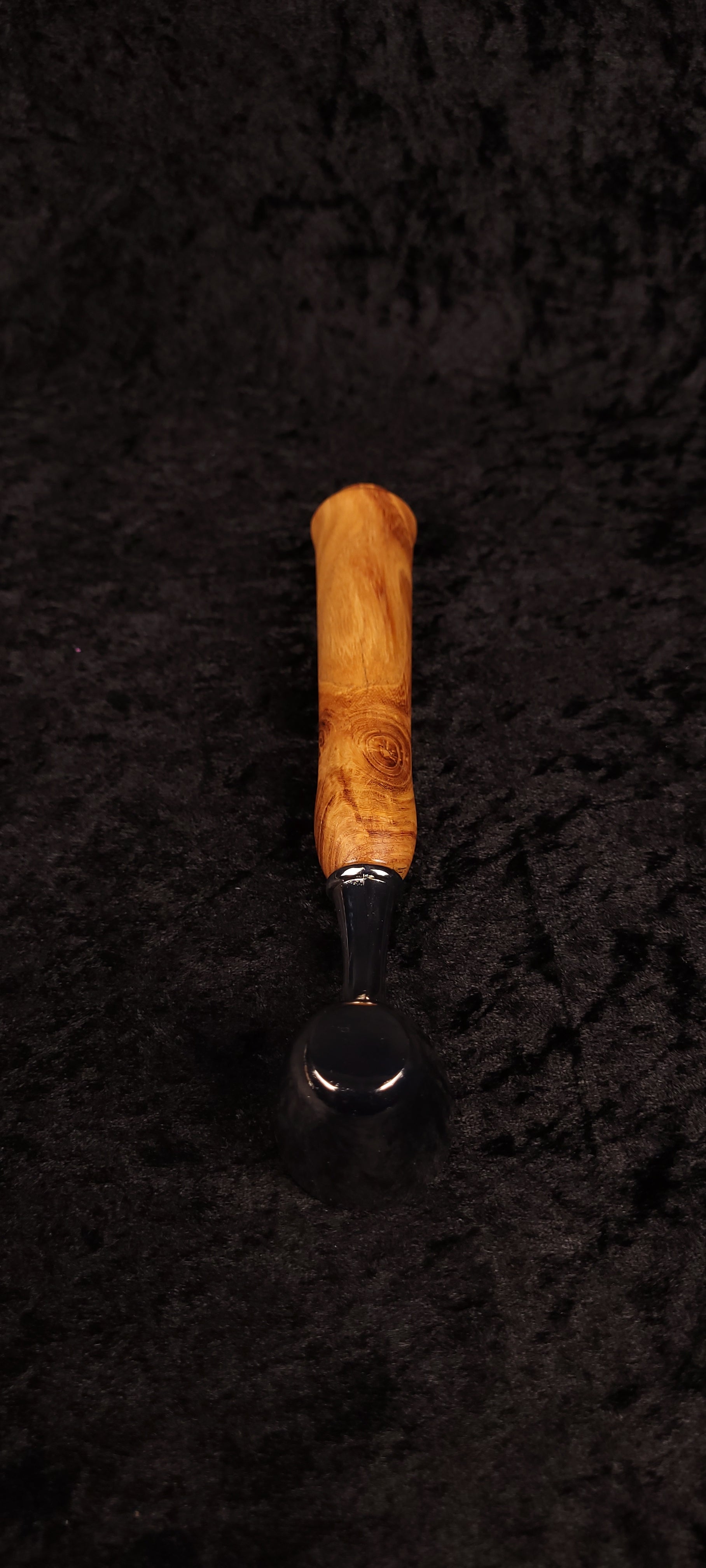 Locust wood coffee scoop top-down view showing handle grain detail
