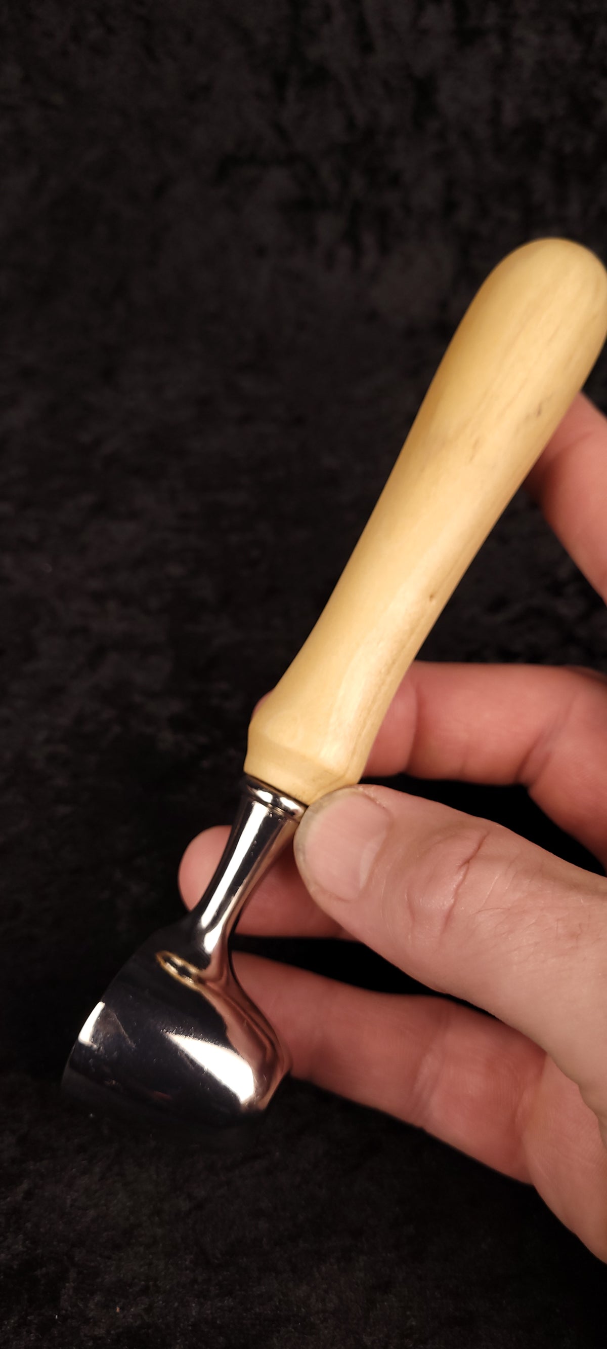 Cottonwood coffee scoop held in hand showing scale and chrome finish