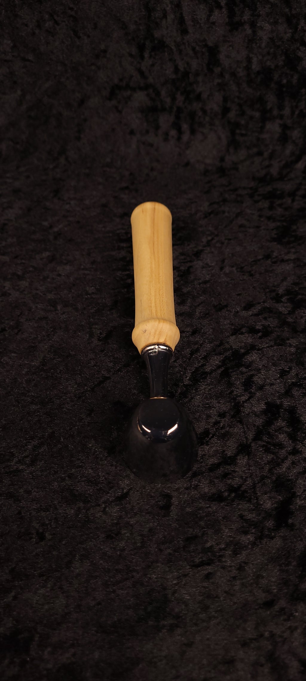 Colorado Cottonwood coffee scoop top-down view on black background