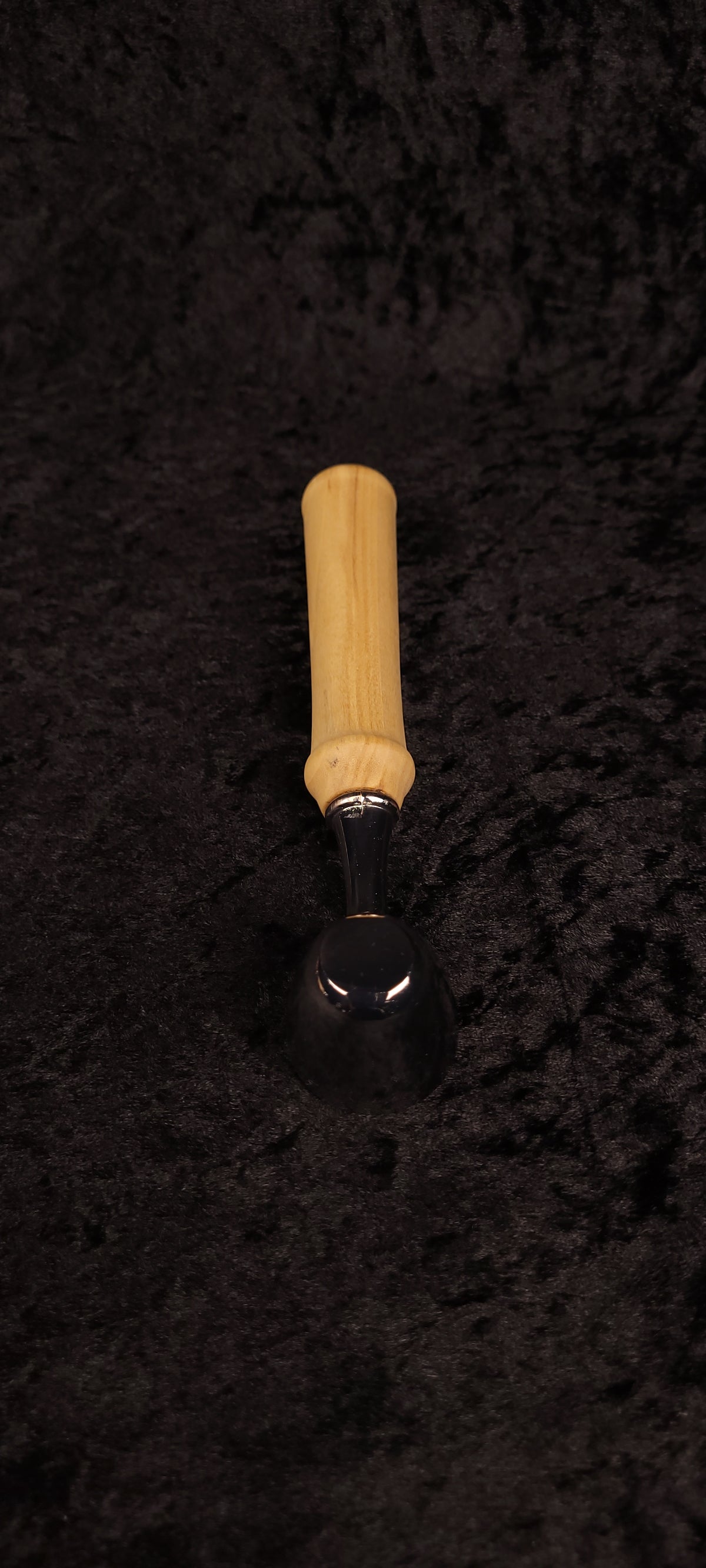Colorado Cottonwood coffee scoop top-down view on black background