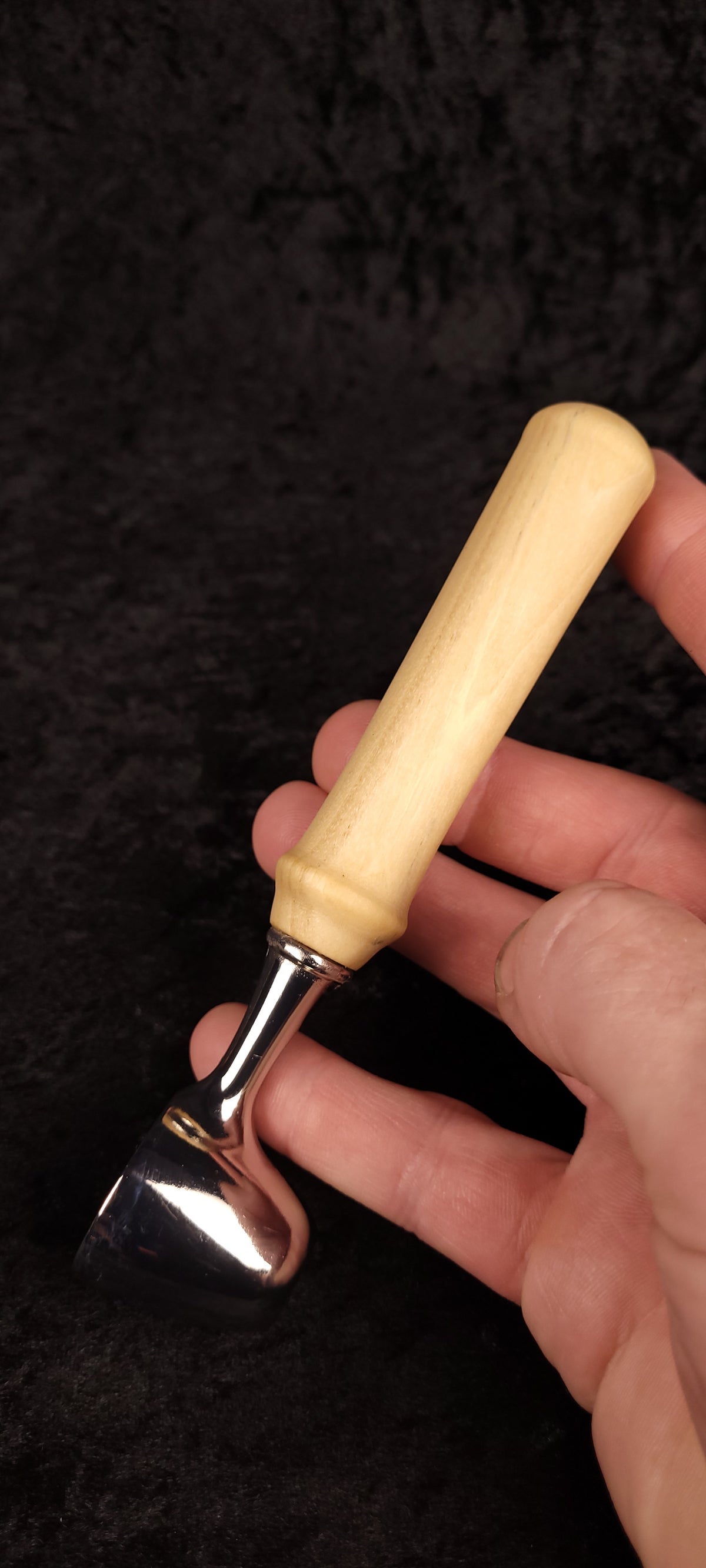 Colorado Cottonwood coffee scoop held in hand showing chrome dome and pale wood handle