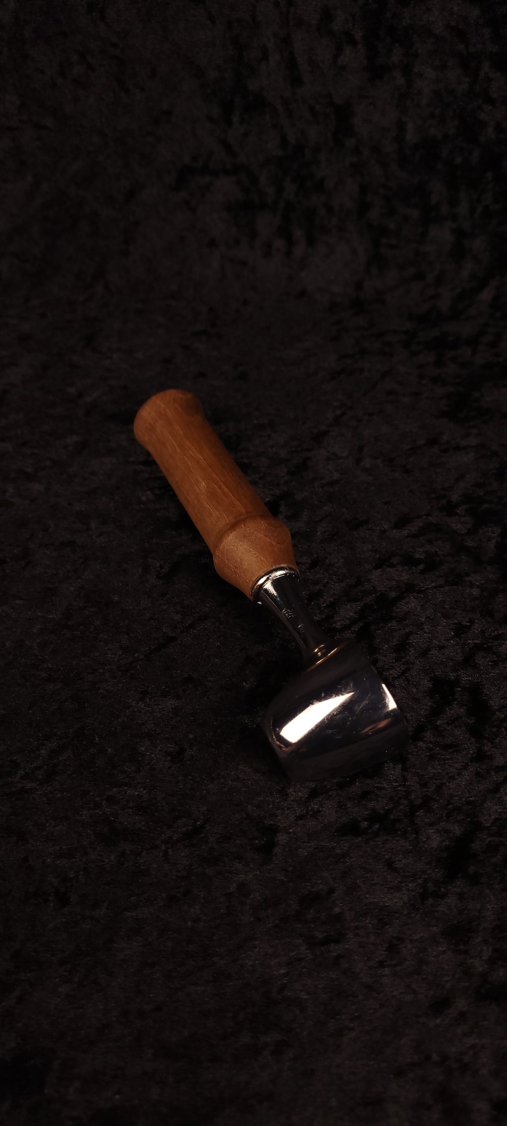 Walnut coffee scoop No. 2 angled view on black background showing chrome dome and warm brown handle
