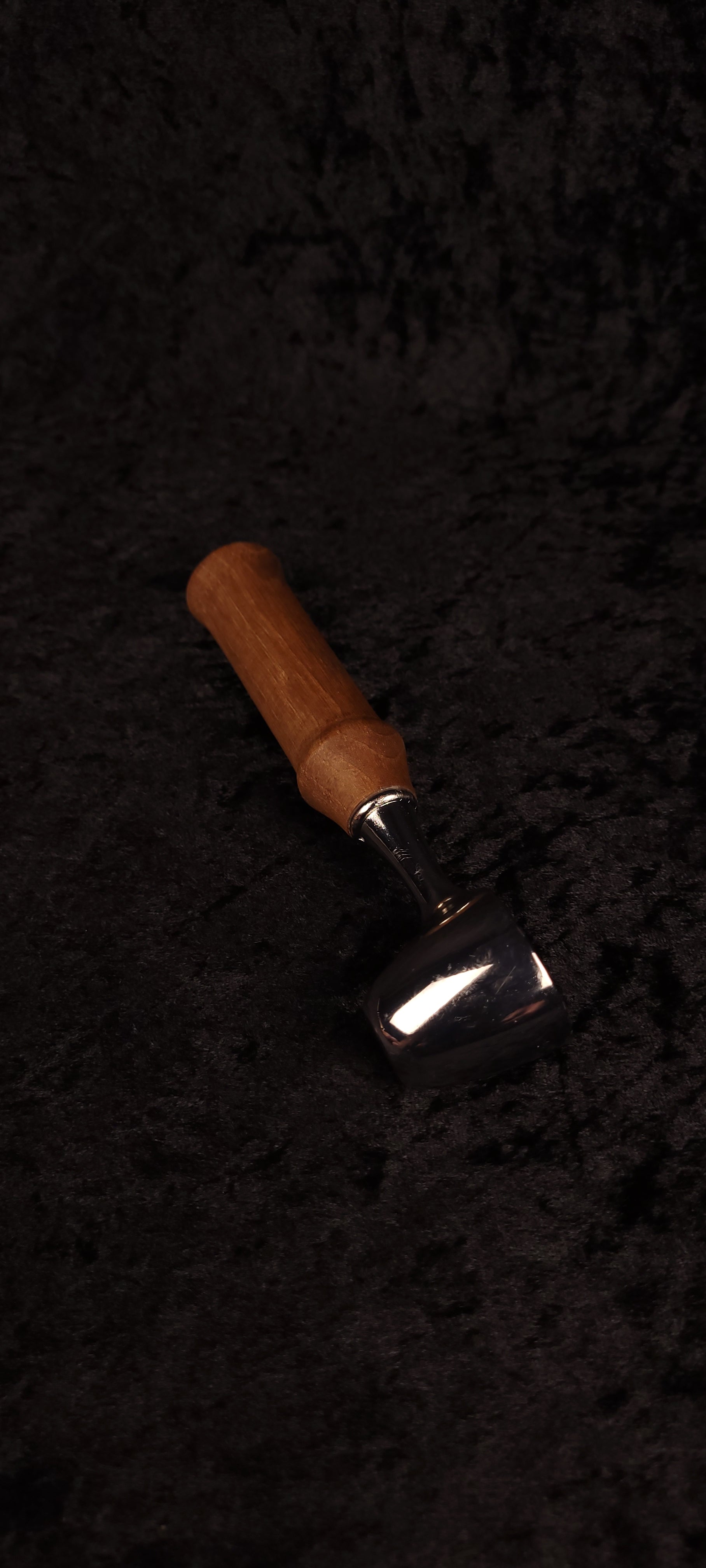 Walnut coffee scoop No. 2 angled view on black background showing chrome dome and warm brown handle