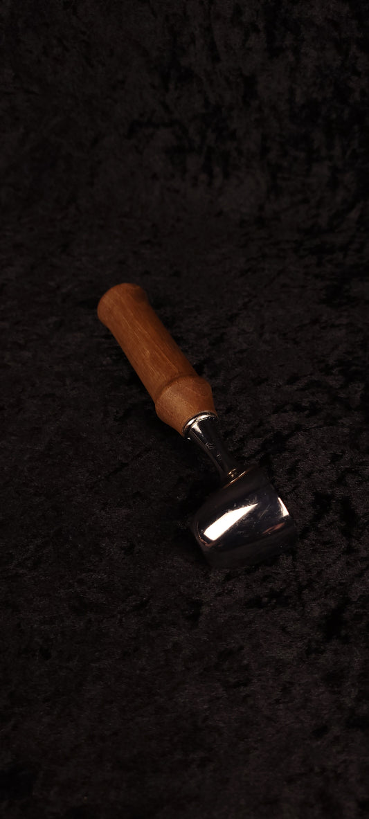 Walnut coffee scoop No. 2 angled view on black background showing chrome dome and warm brown handle