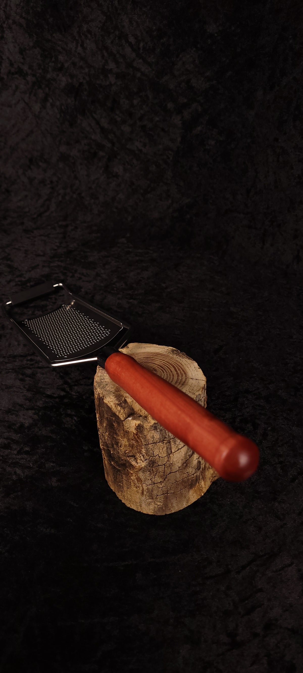 Rasp grater components separated showing handle and grating surface