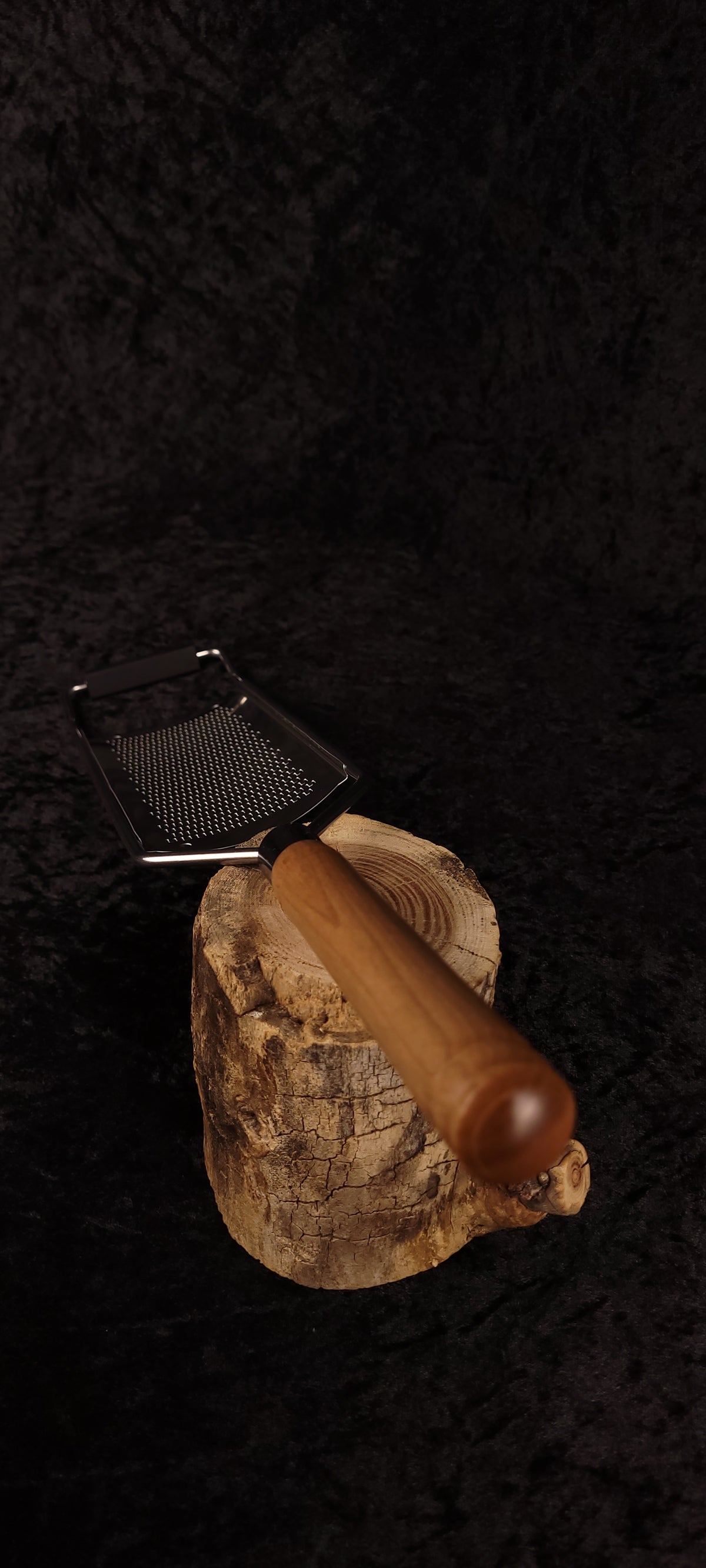 Curly maple grater on wood round, alternate angle