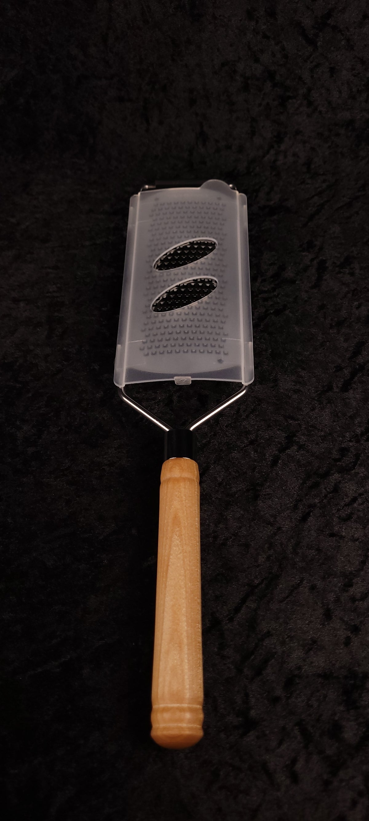 Curly maple grater with guard, top-down view