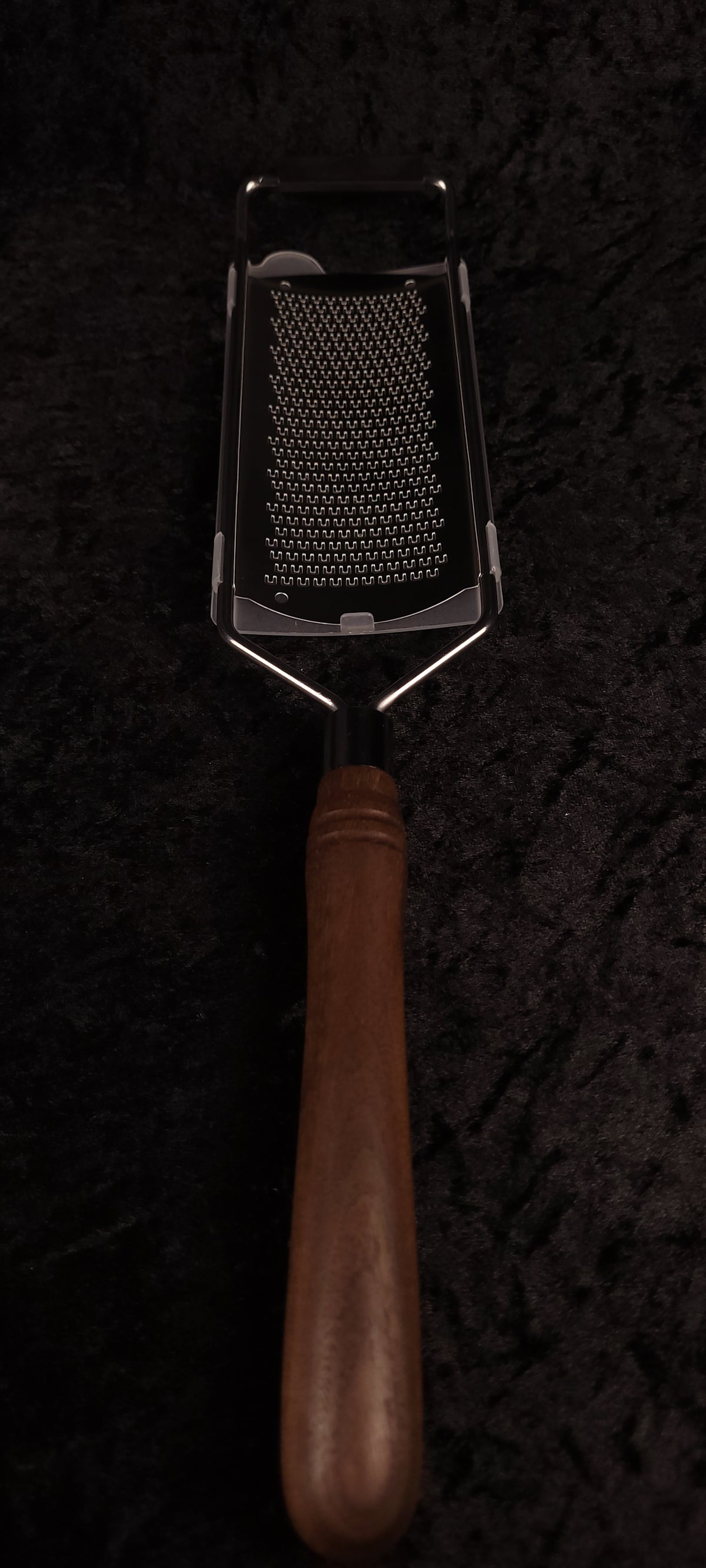 Walnut rasp grater top-down view showing grating surface