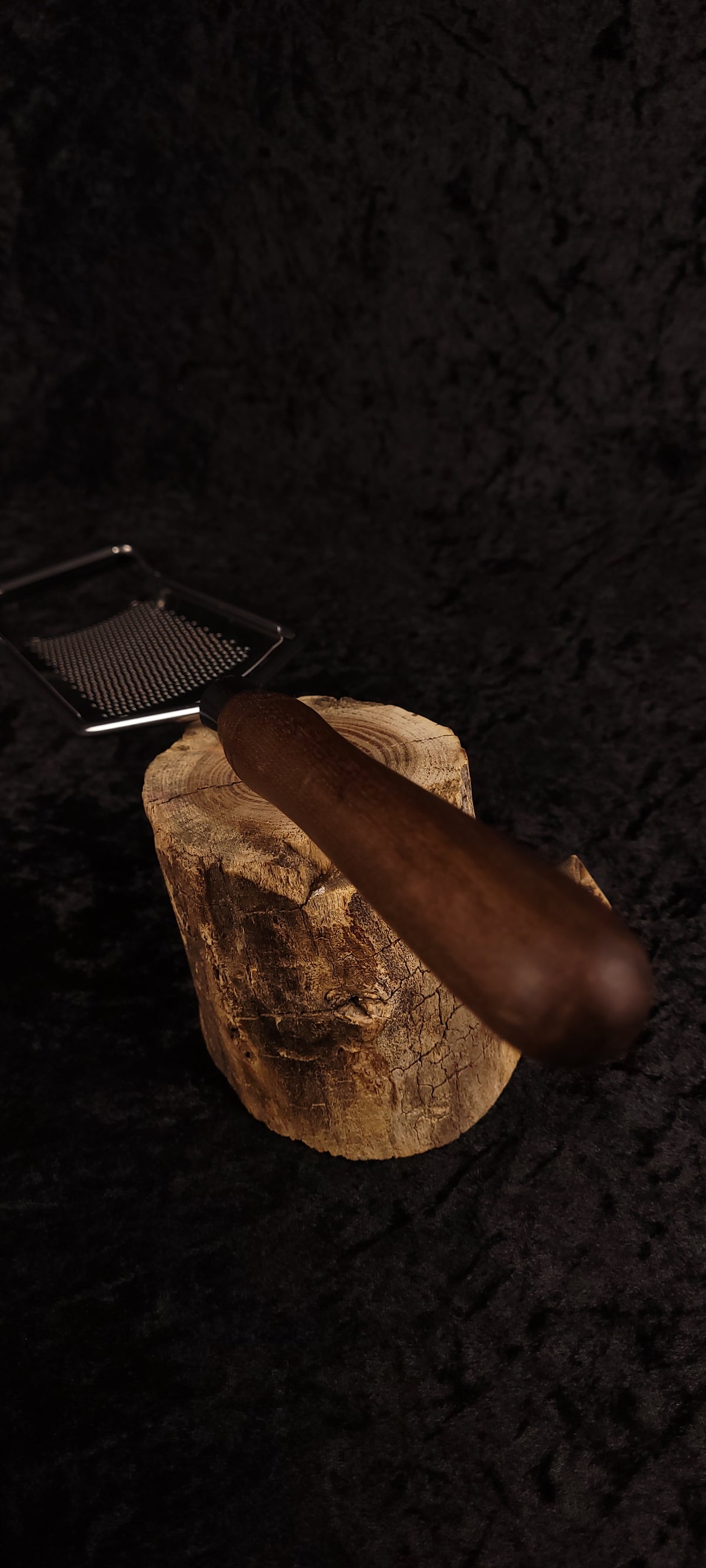 Walnut rasp grater on wood round alternate angle