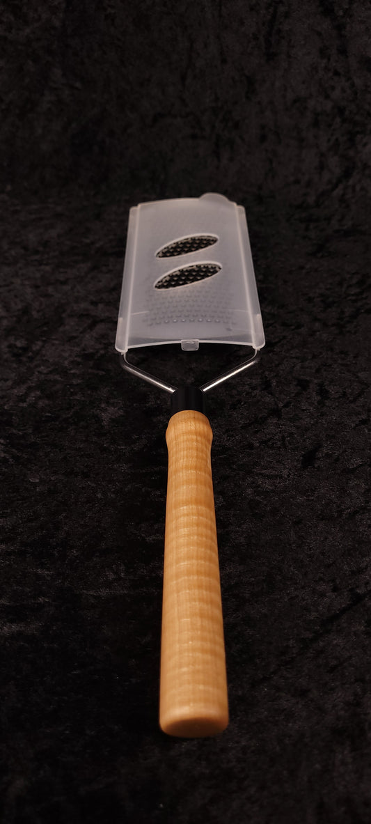 Curly maple rasp grater assembled, top-down view with guard