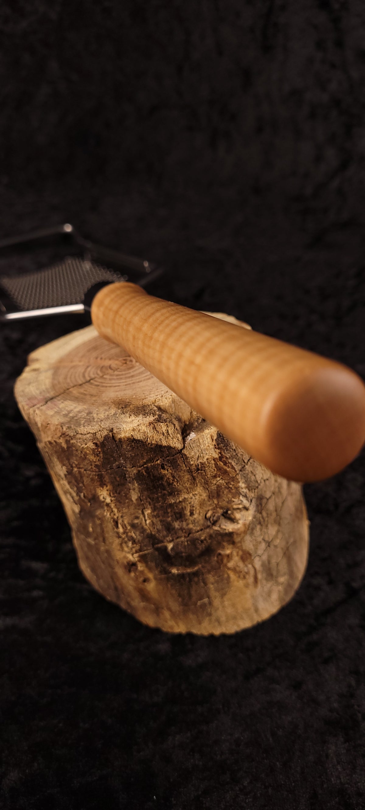 Curly maple rasp grater handle on wood round, alternate angle