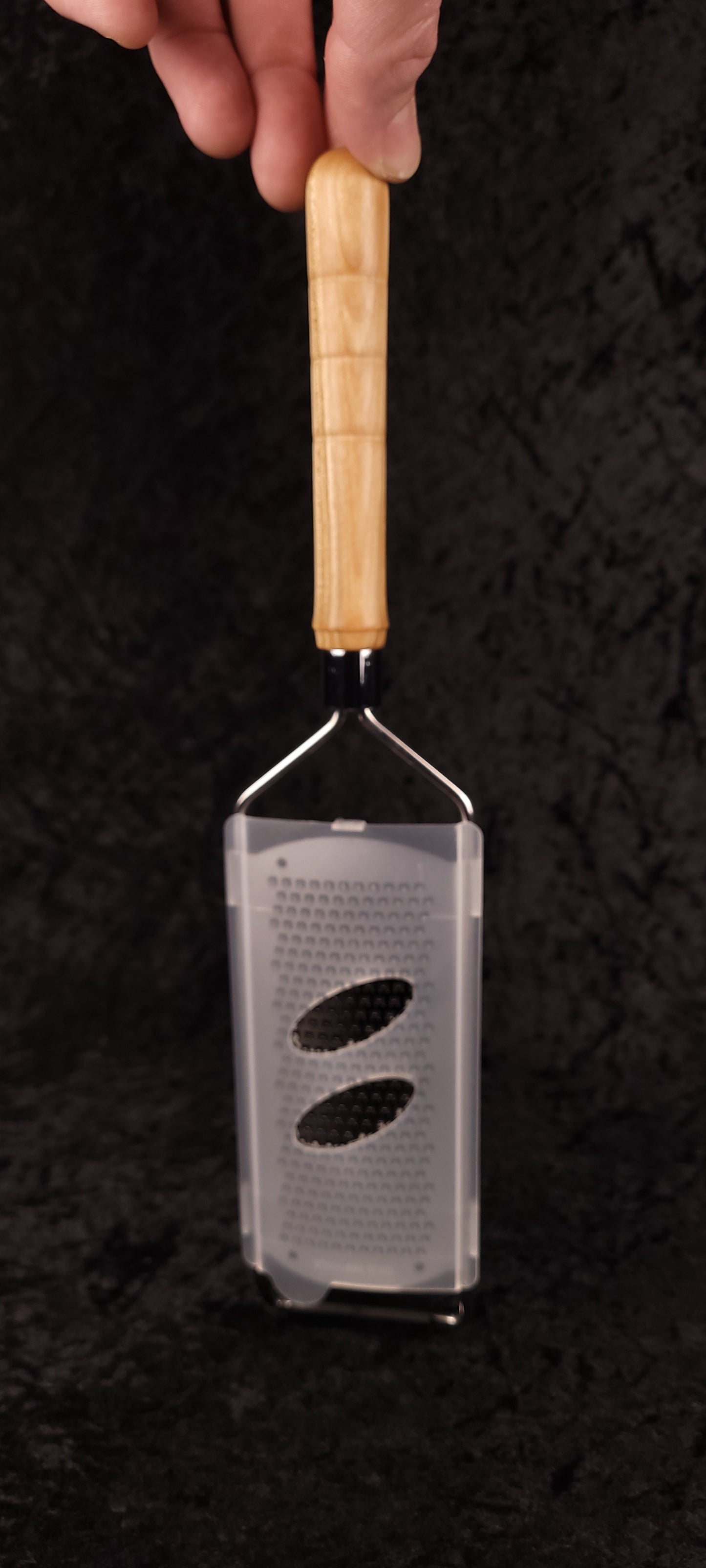Curly maple rasp grater with guard and handle separated, flat lay