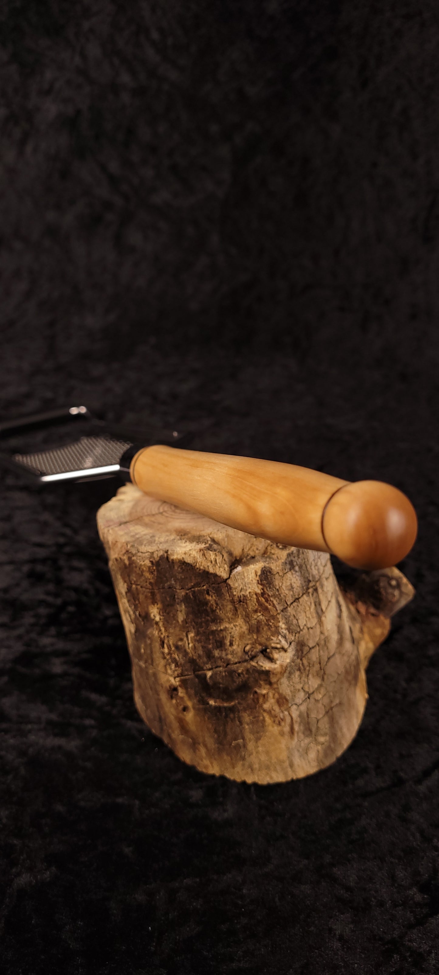 Maple flat grater on wood round, alternate angle