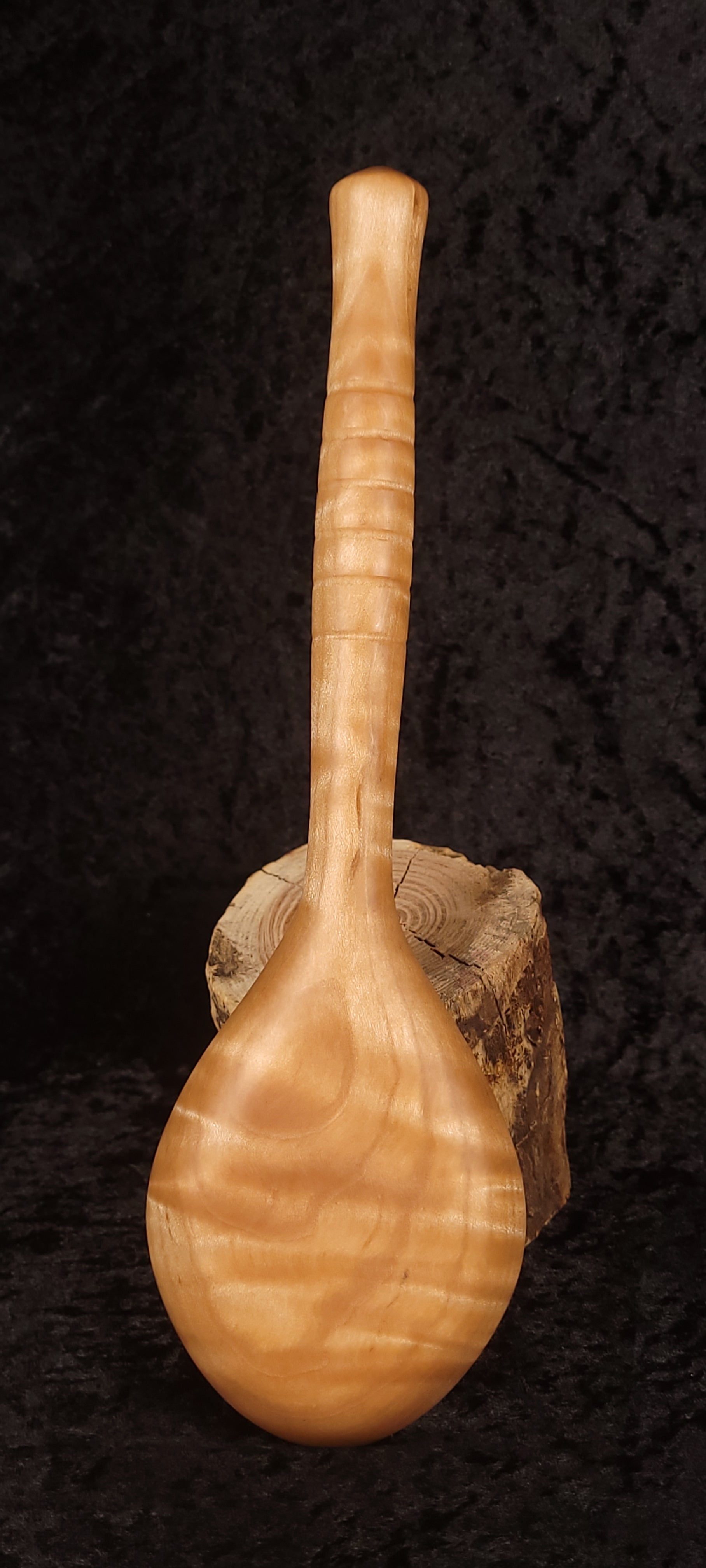 Curly maple spoon front view showing deep bowl and figuring