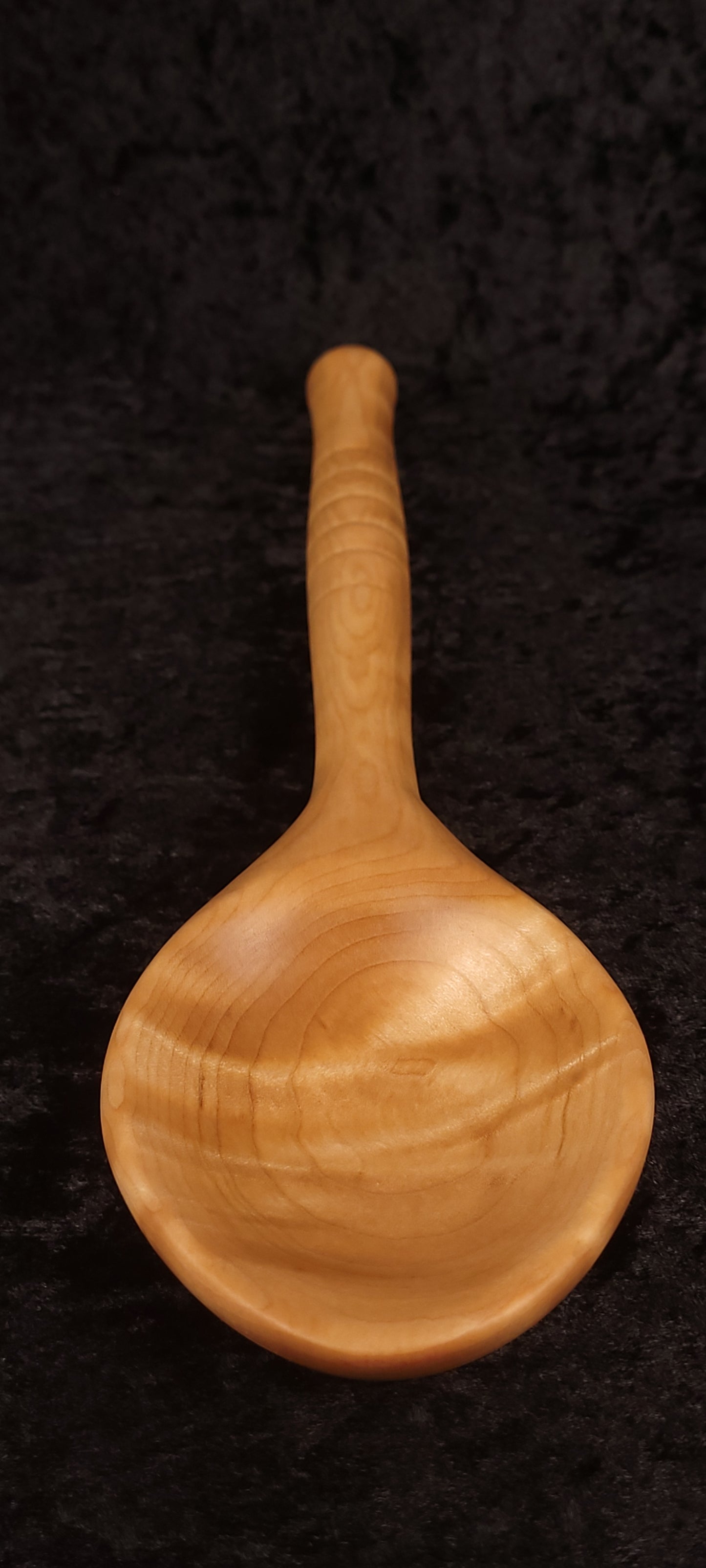 Curly maple spoon front view showing full length and figuring