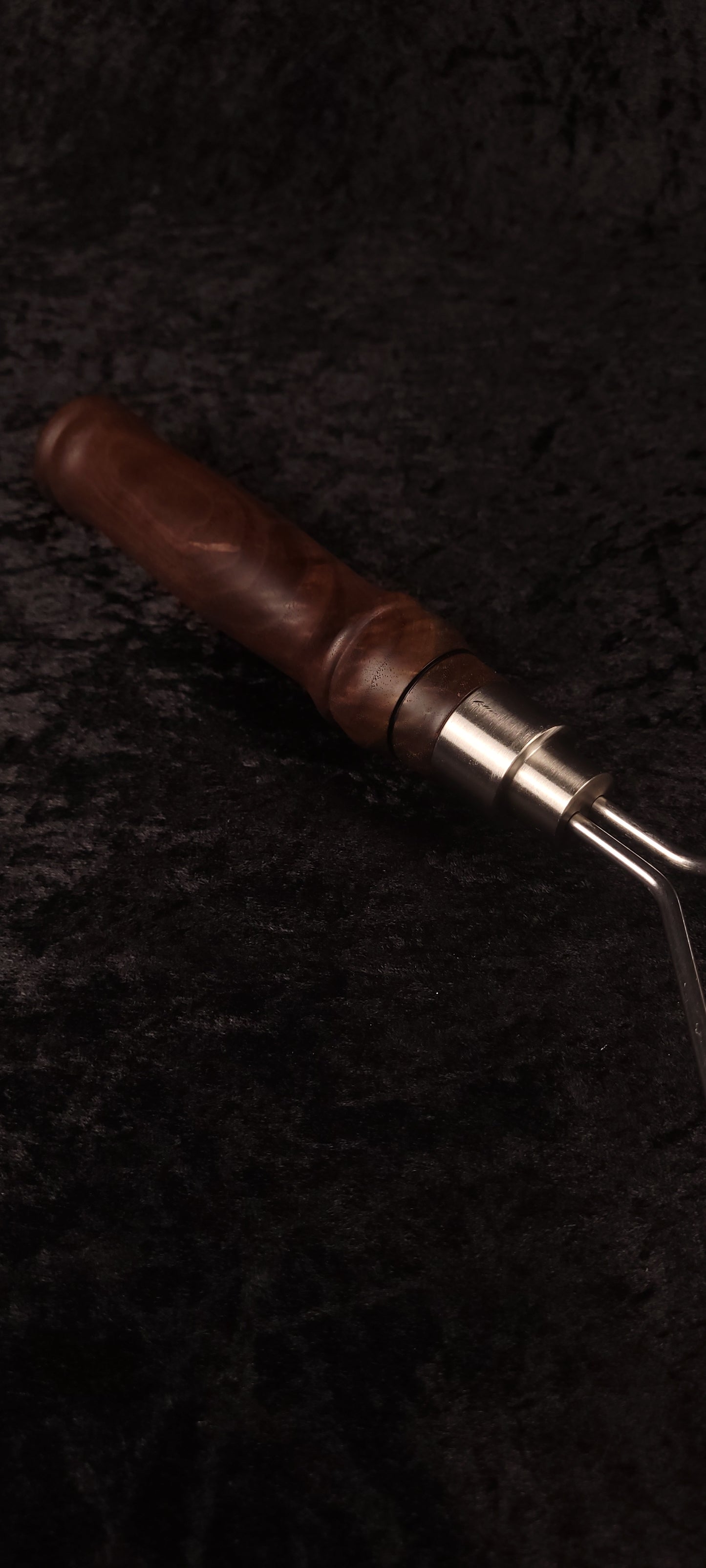 Walnut potato masher handle and ferrule close-up, alternate angle