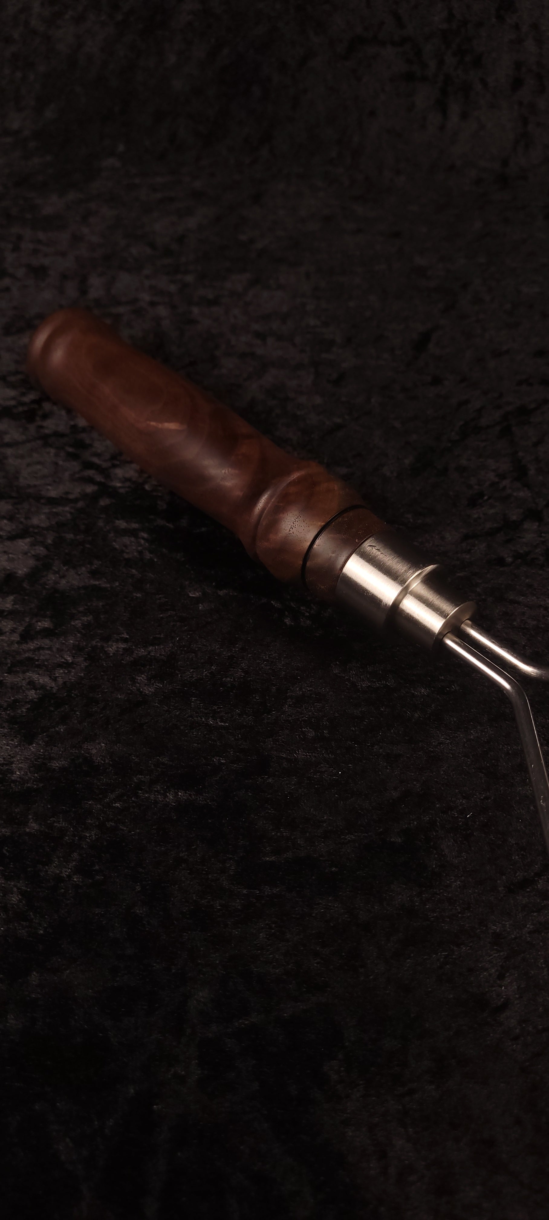 Walnut potato masher handle and ferrule close-up, alternate angle