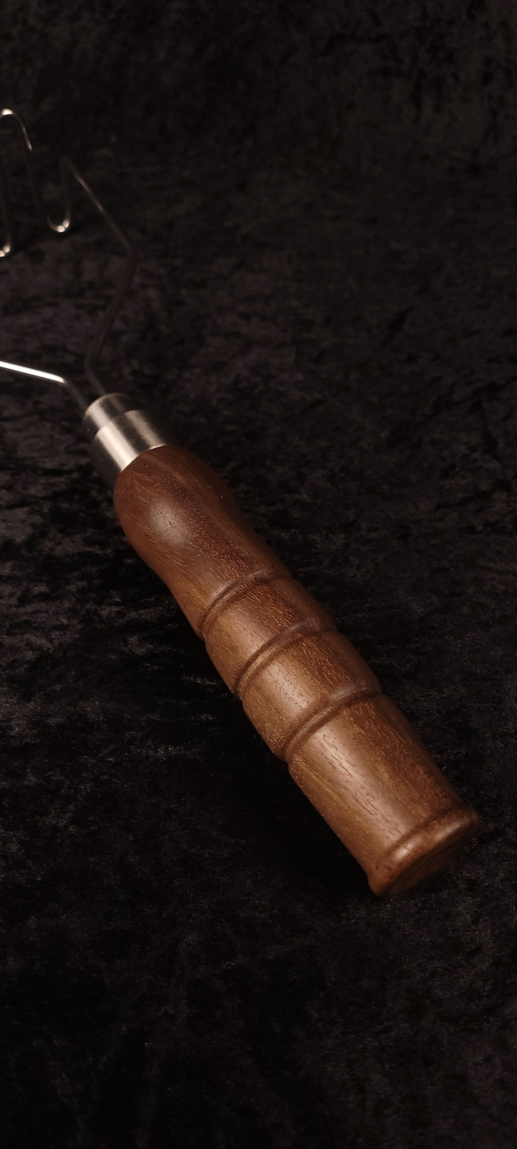 Walnut potato masher top-down view, alternate angle