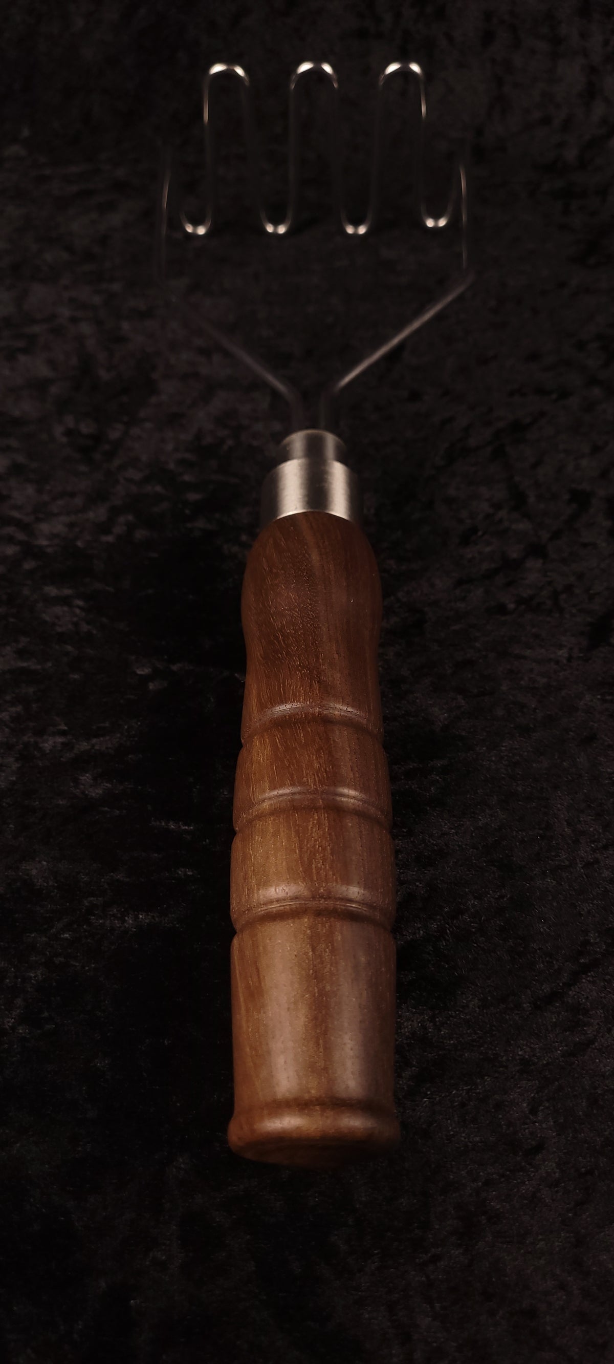 Walnut potato masher full length, handle up view