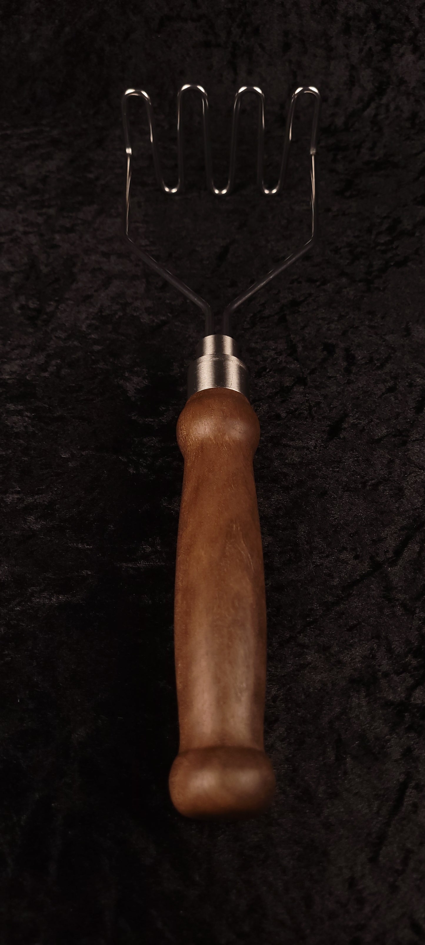 Walnut potato masher full length top-down, wire head up