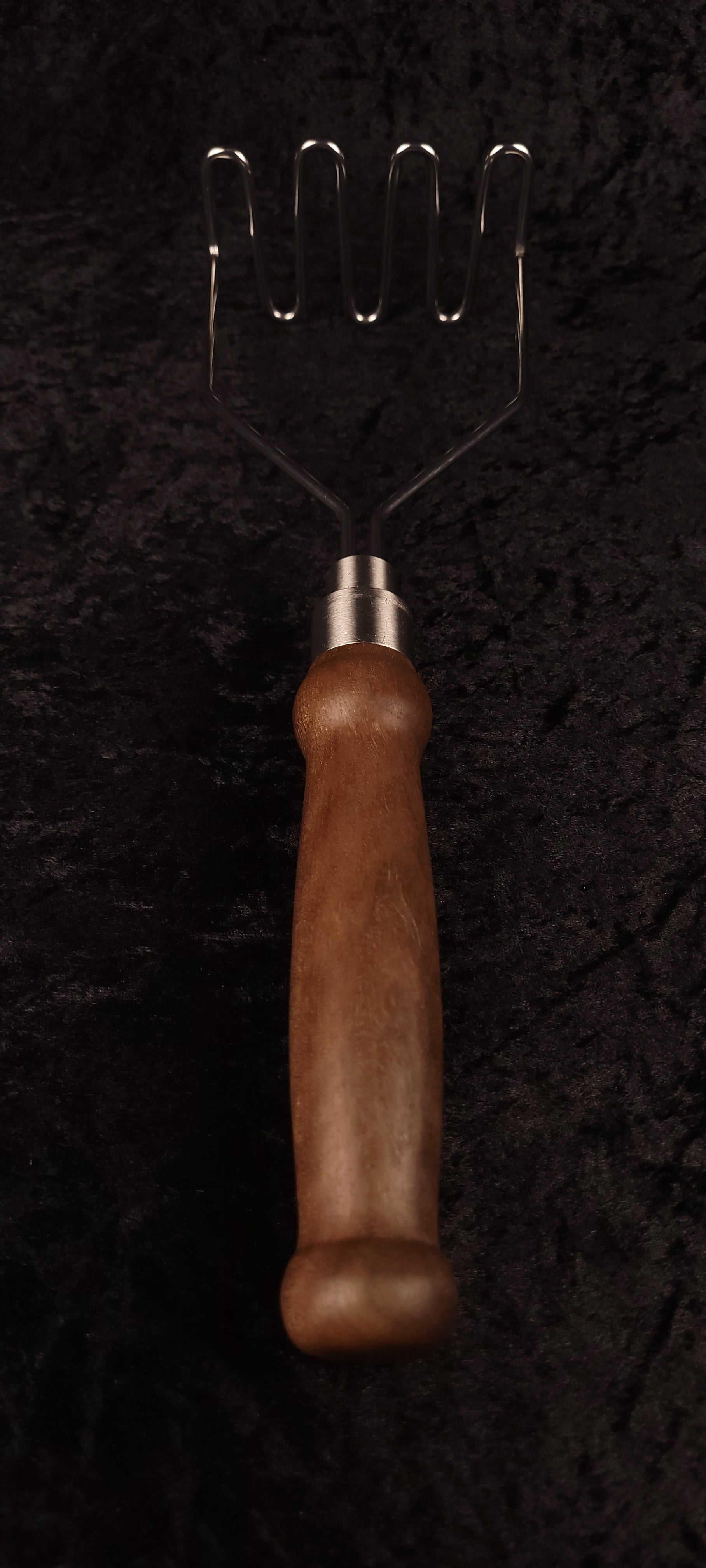 Walnut potato masher full length top-down, wire head up