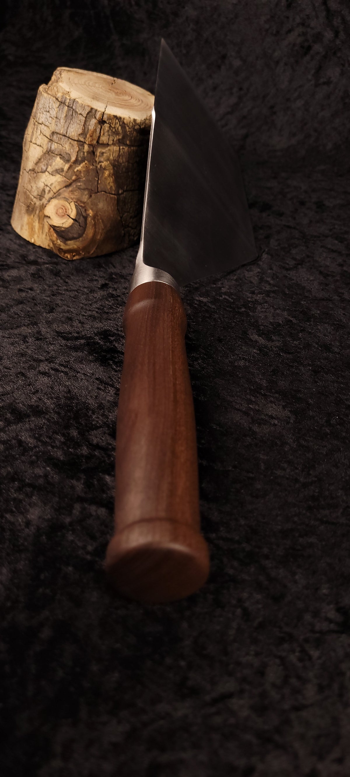 Griddle spatula walnut handle No. 3 – angled side view with log prop