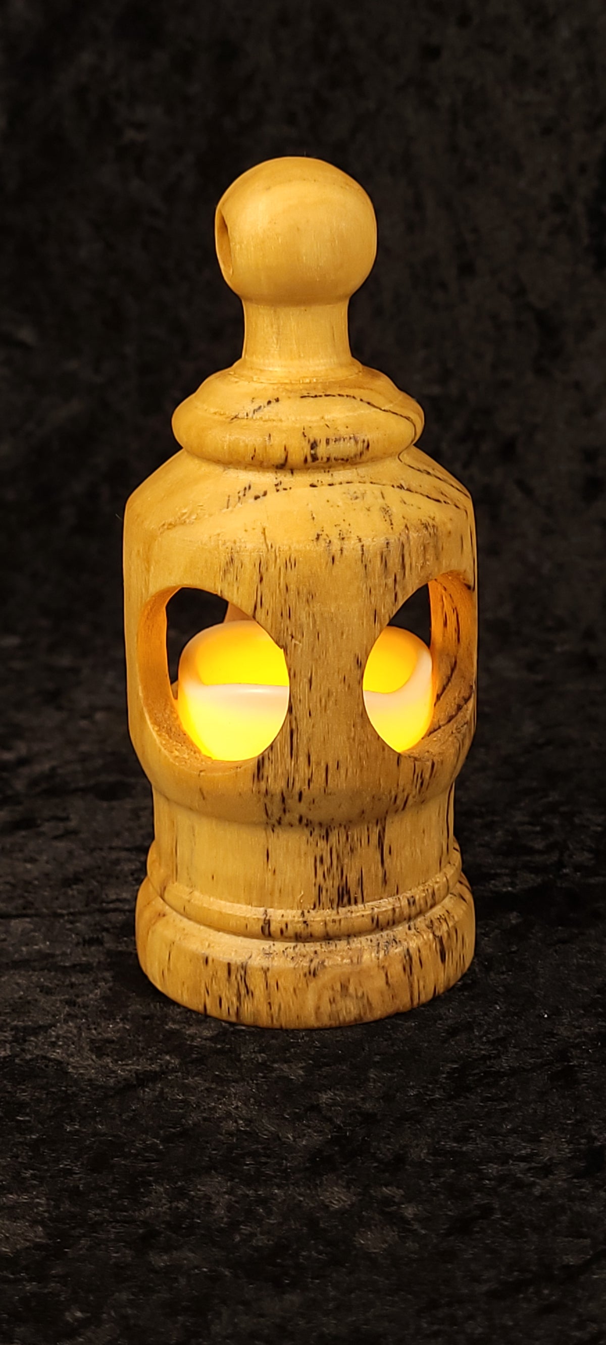 Cottonwood lantern tipped on side showing hollow interior and LED tea light